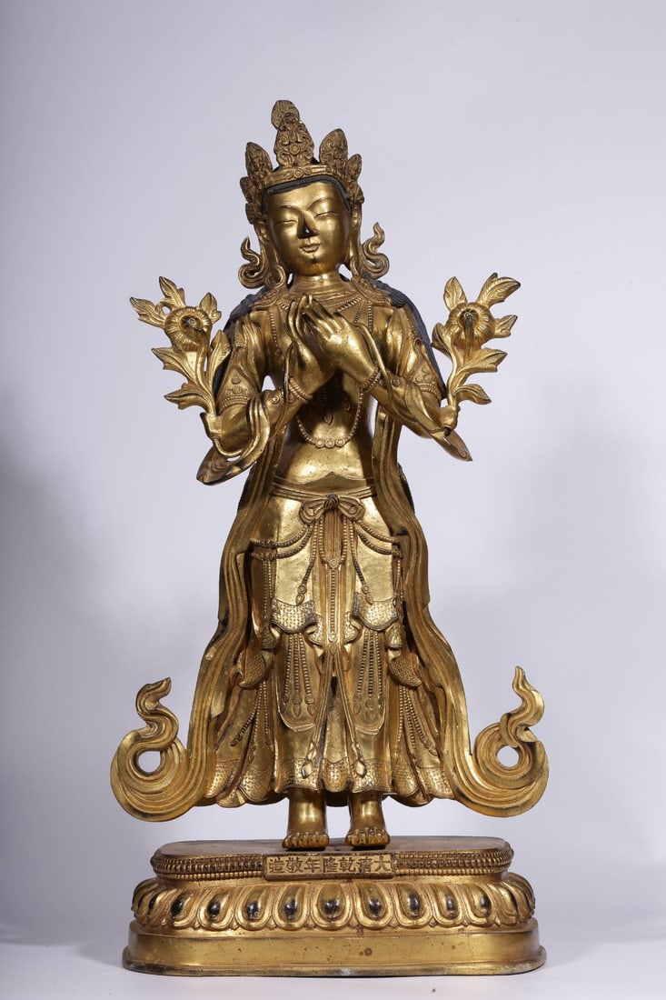 A Gilt Bronze Guanyin Statue: A Gilt Bronze Guanyin Statue. Height: 21.26"; Length: 10.24"; Width: 6.30". Weight: 69.89lbs.