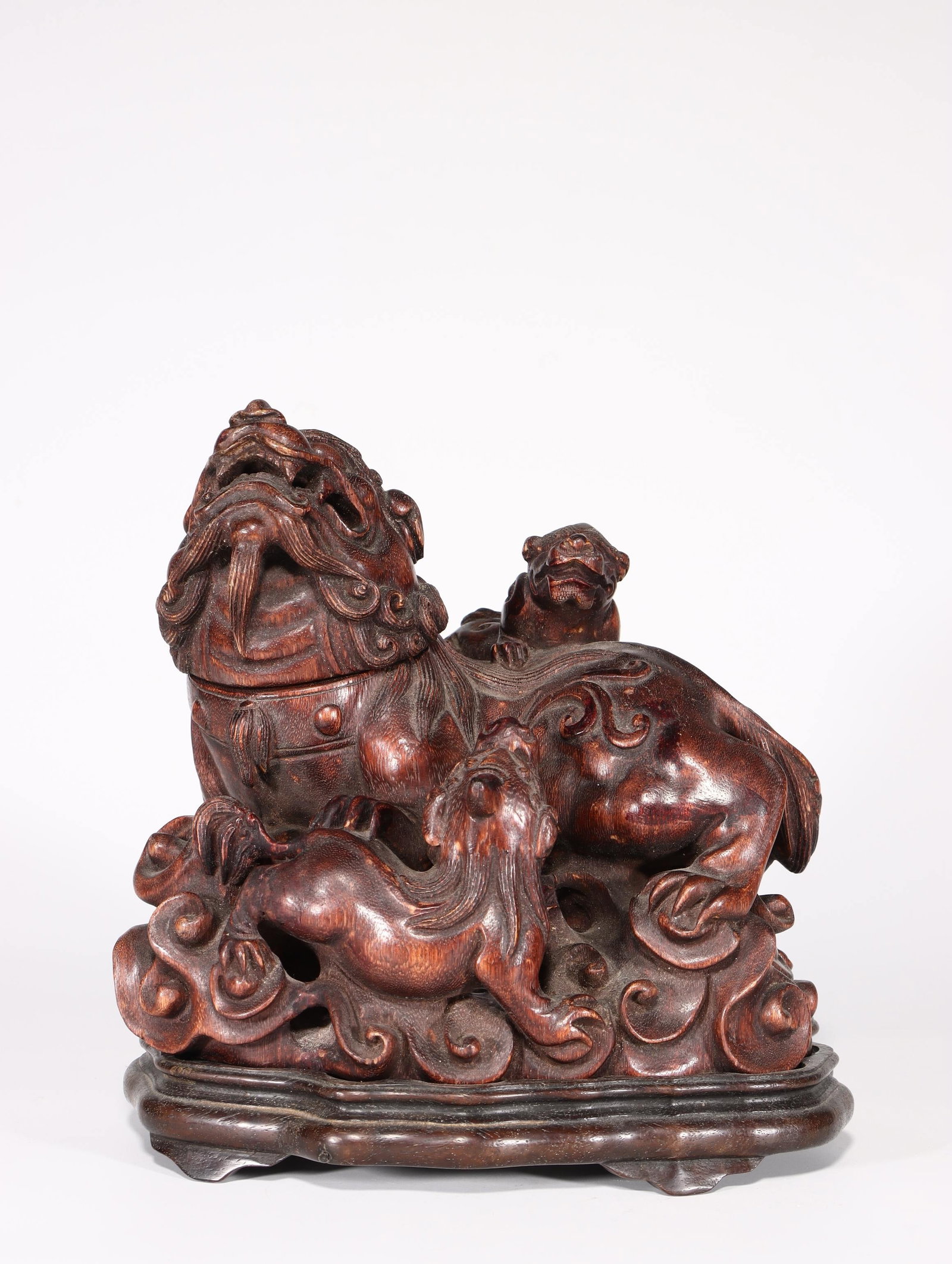 An Agarwood Figure: An Agarwood Figure. Height: 8.86"; Length: 7.48"; Width: 5.51". Weight: 2.76lbs.