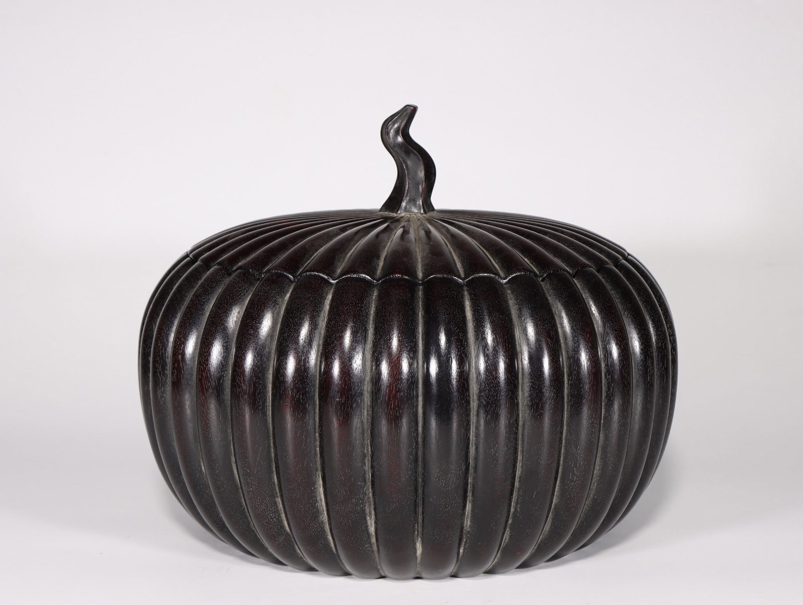 A Rosewood Tea Caddy: A Rosewood Tea Caddy. Height: 10.83"; Diameter: 9.84". Weight: 10.14lbs.