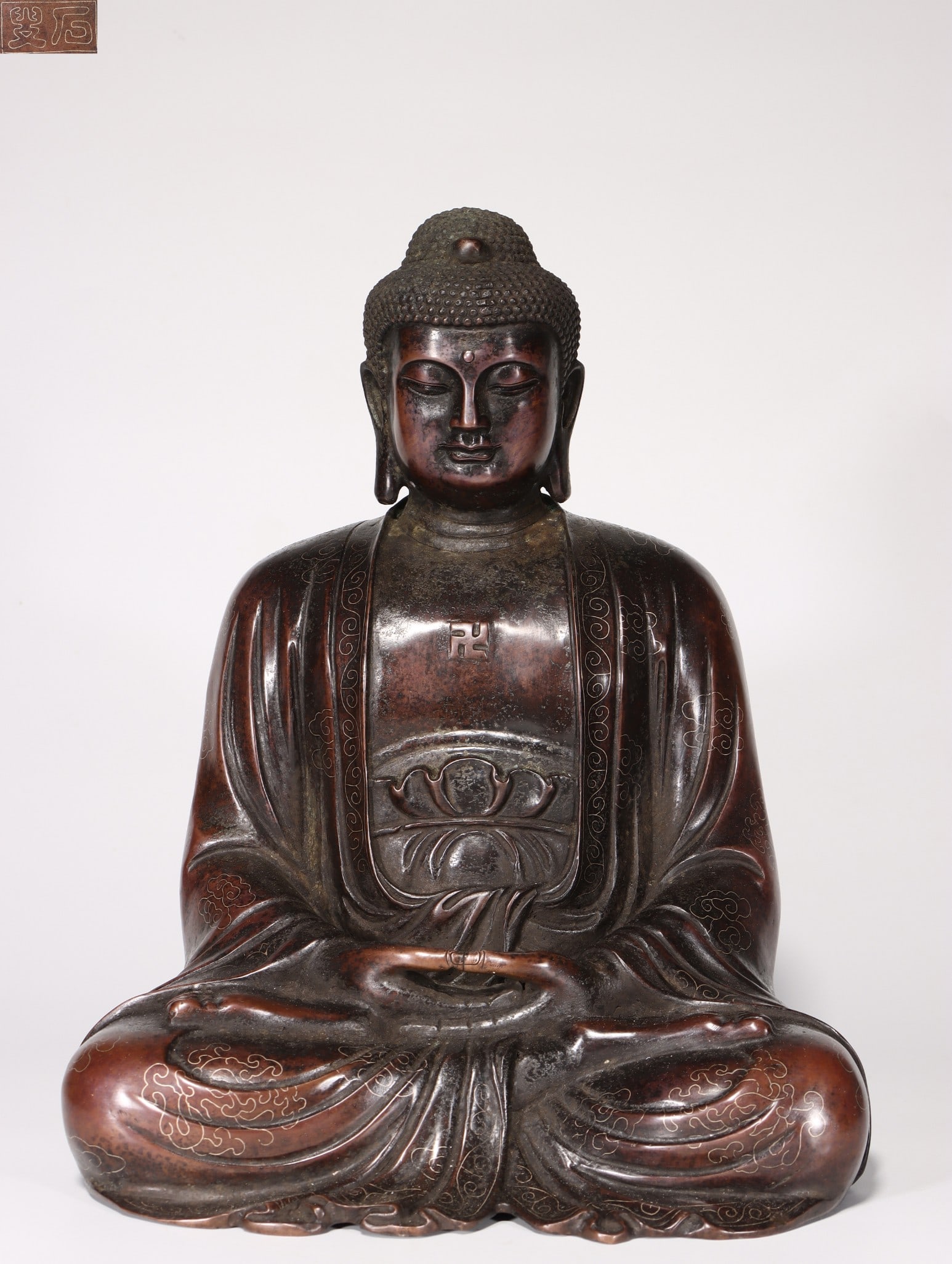 A Bronze Shakyamuni Statue: A Bronze Shakyamuni Statue. Height: 12.01"; Length: 9.45"; Width: 7.87". Weight: 21.16lbs.