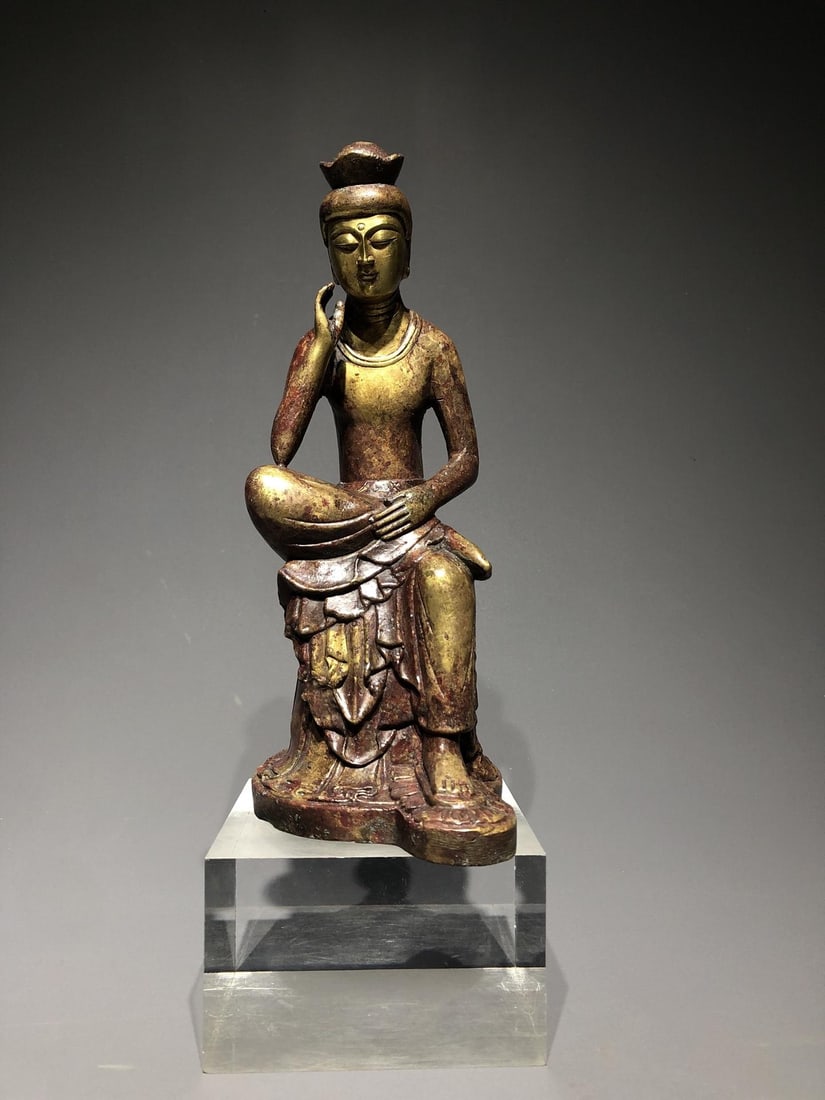 A Gilt Bronze Buddha: A Gilt Bronze Buddha. Diameter: 4.72"; Width: 3.15"; Height: 8.66". Weight: 5.51lbs.