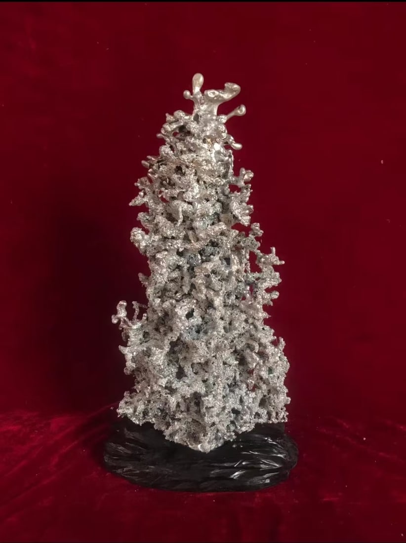 An Aluminum Sculpture: An Aluminum Sculpture. Height: 18.11"; Length: 6.30"; Width: 6.69". Weight: 7.72lbs.