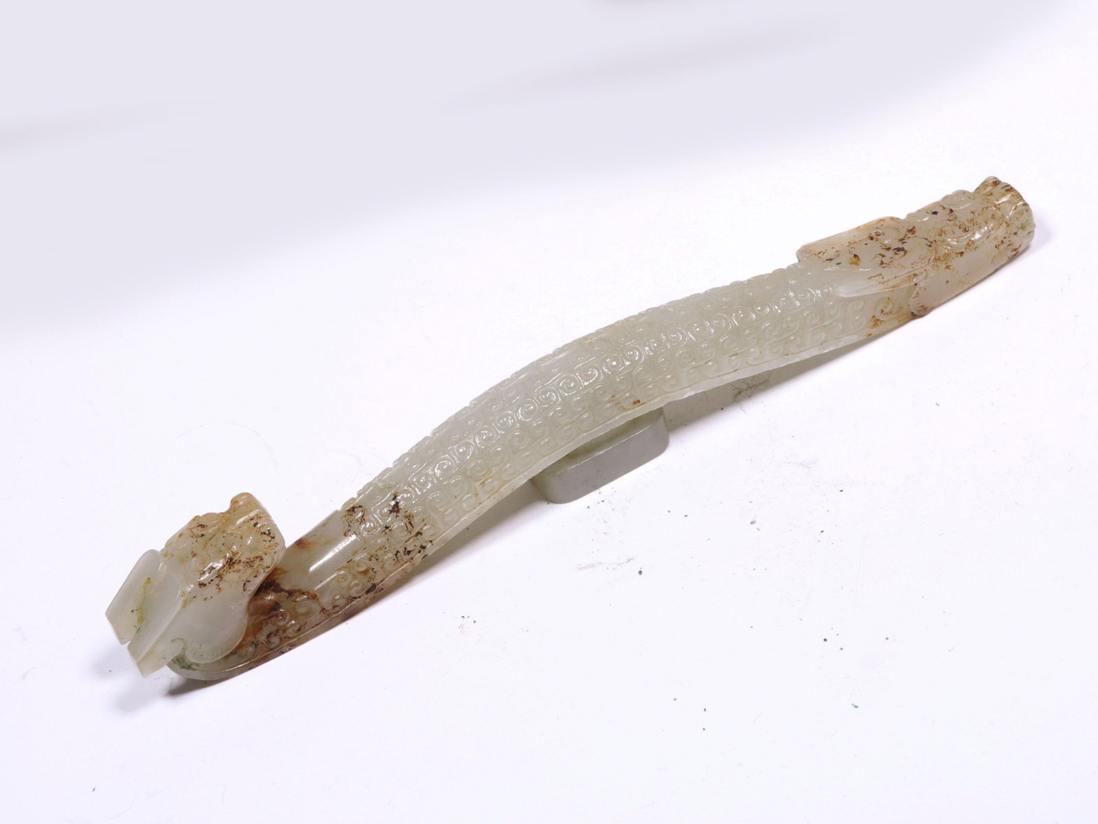 A Jade Belt Hook: A Jade Belt Hook. Dimensions: 7.09" x 0.67" x 0.87".