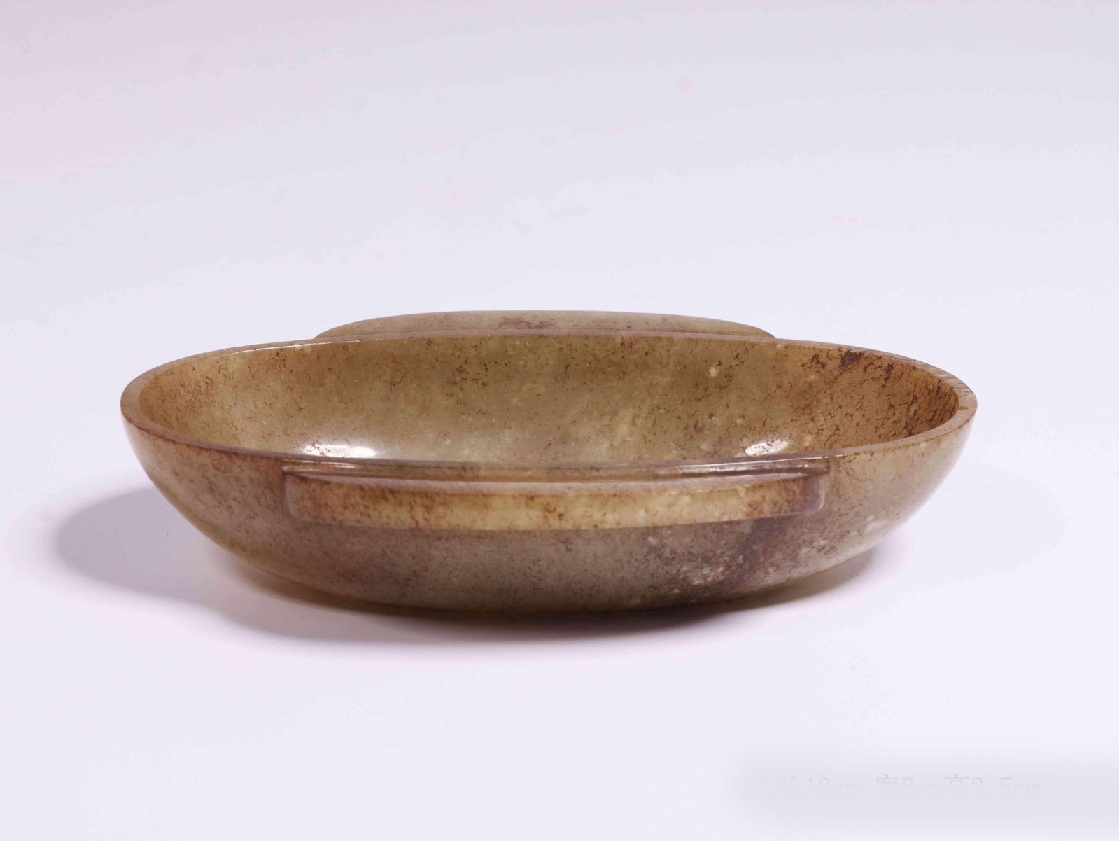 A Jade Cup: A Jade Cup. Dimensions: 4.72" x 3.15" x 0.98".