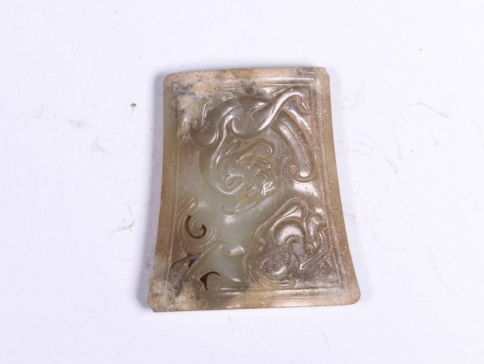 A Jade Sword Fitting: A Jade Sword Fitting. Dimensions: 2.60" x 2.32" x 0.71".