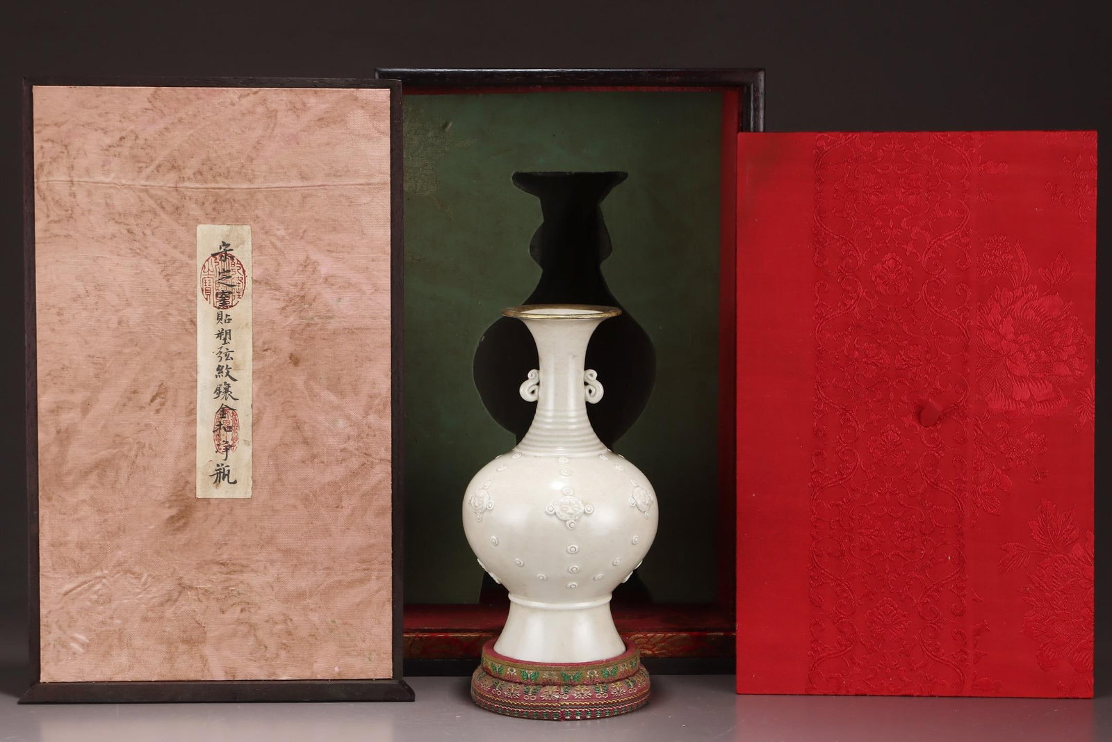 A Ding Ware Applied-Decor Double-Eared Vase With Gilt Mount: A Ding Ware Applied-Decor Double-Eared Vase With Gilt Mount. Dimensions: 8.66in x 4.92in.