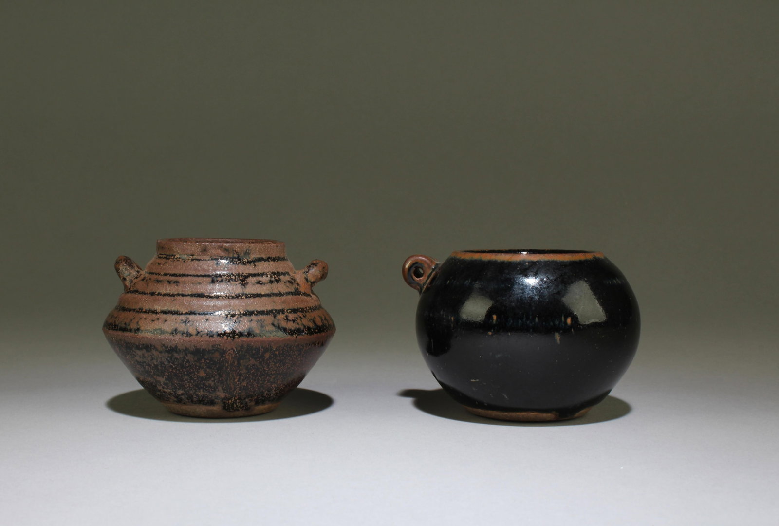 A Pair of Cizhou Jars: A Pair of Cizhou Jars. Dimensions: 2.2" X 3"