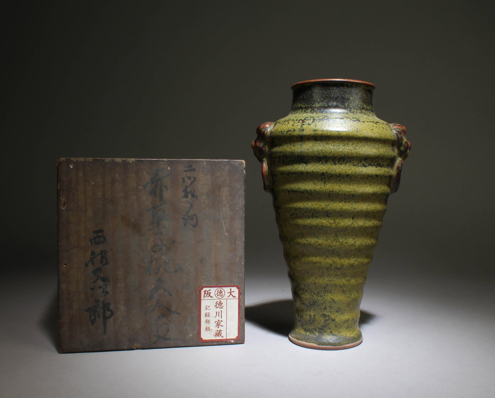 A Tea Dust Glaze Taotie Vase: A Tea Dust Glaze Taotie Vase. Dimensions: 9.1" x 6".