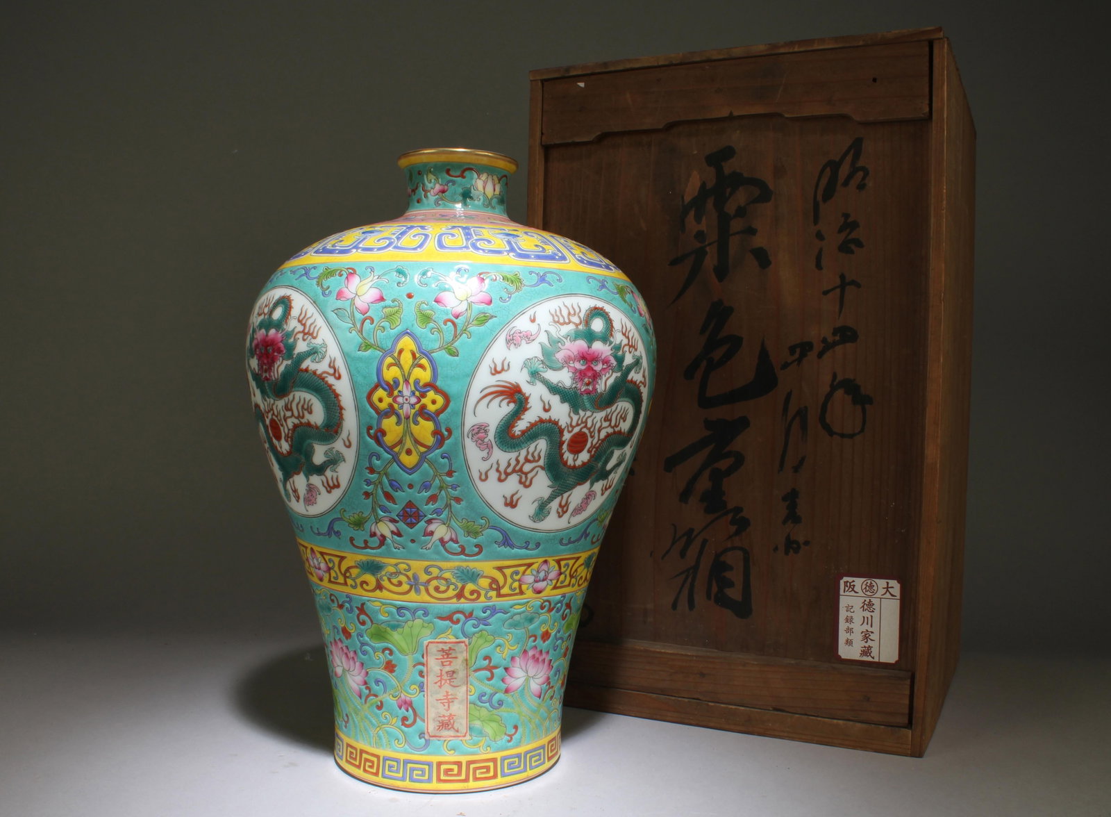 An Engraved Fencai Vase: An Engraved Fencai Vase. "QianLong" mark at base. Dimensions: 12.2" x 8.5"