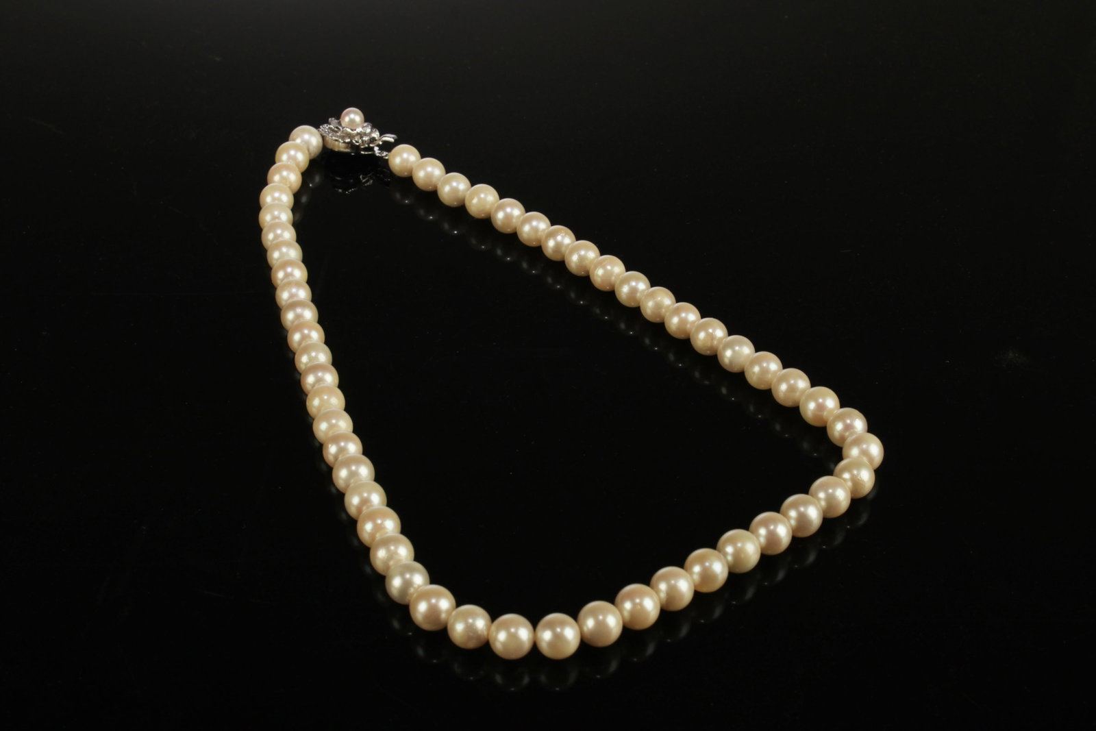 A Pearl Necklace: A Pearl Necklace. Length: 8". Pearl Diameter: ~7.5mm