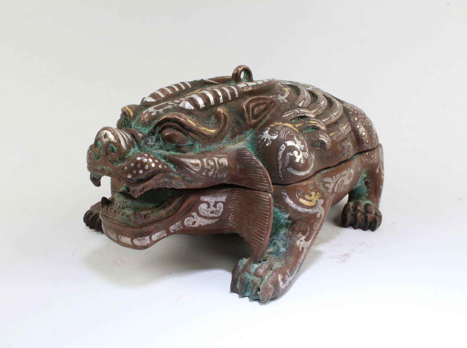 A Gilt Bronze Mythical Beast Figurine: A Gilt Bronze Mythical Beast Figurine. Dimension: 10" x 6 x 5".