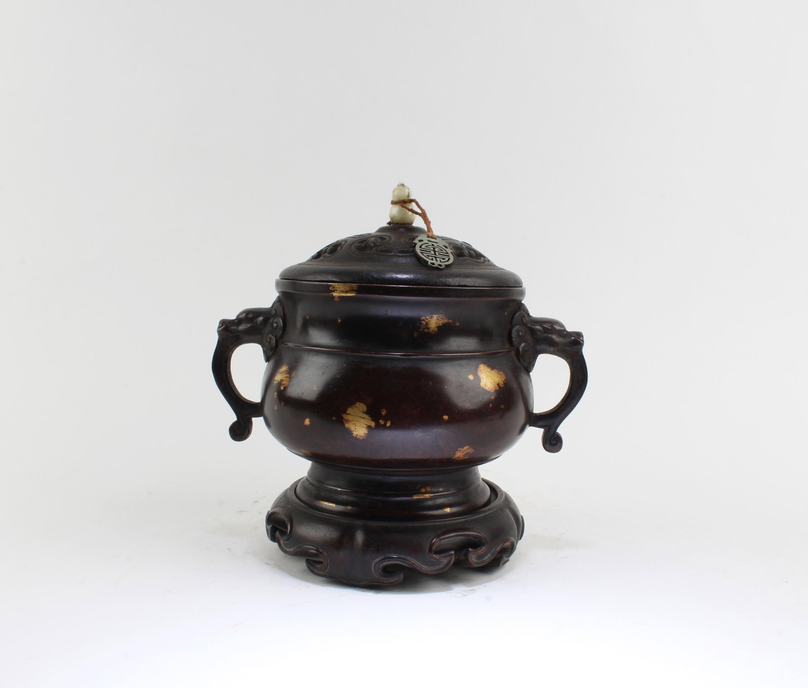 A Gilt Bronze Censer: A Gilt Bronze Censer with wooden lid cover. 'XuanDe' mark at base. Comes fitted with a wooden stand. Length: 8.7" Height: 8.7" (Include stand)