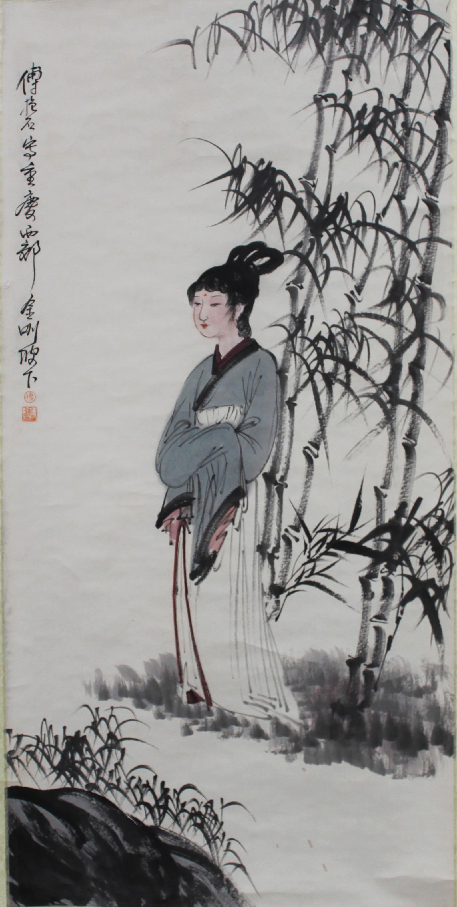 Chinese Scroll Painting: Ink and color on paper, depicting a maiden surrounded by bamboo trees, signed with seal attributed to Fu Bao Shi. Length: 26" Height: 53"