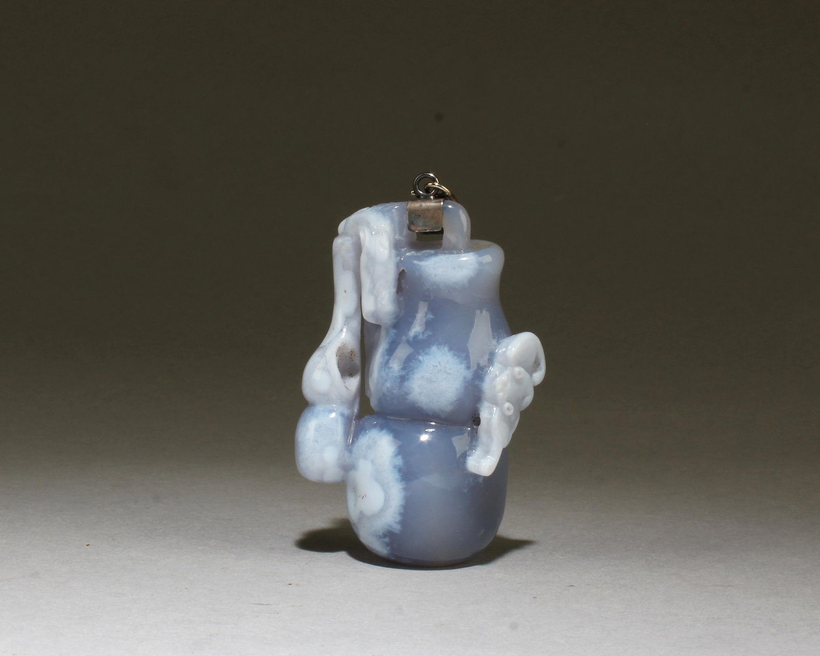 A Carved Agate Pandant: A Carved Agate Pandant. Height: 3"
