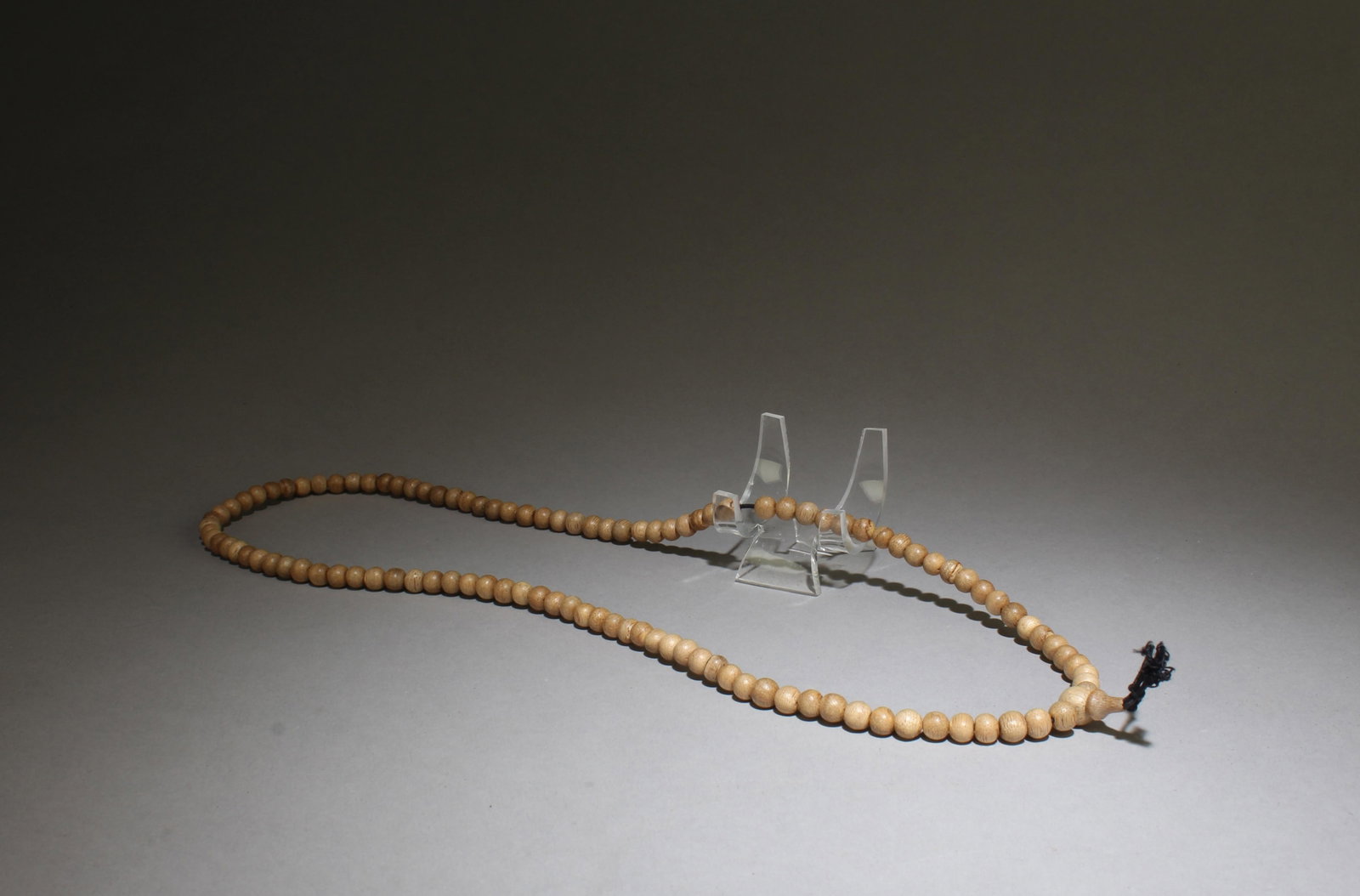 An Agarwood Necklace: An Agarwood Necklace. Bead Diamater: 0.25". Length: 12"