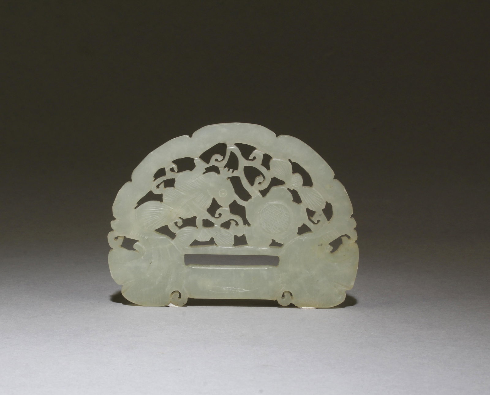 A Carved Openwork Jade Ornament: A Carved Openwork Jade Ornament. Length: 3.5"