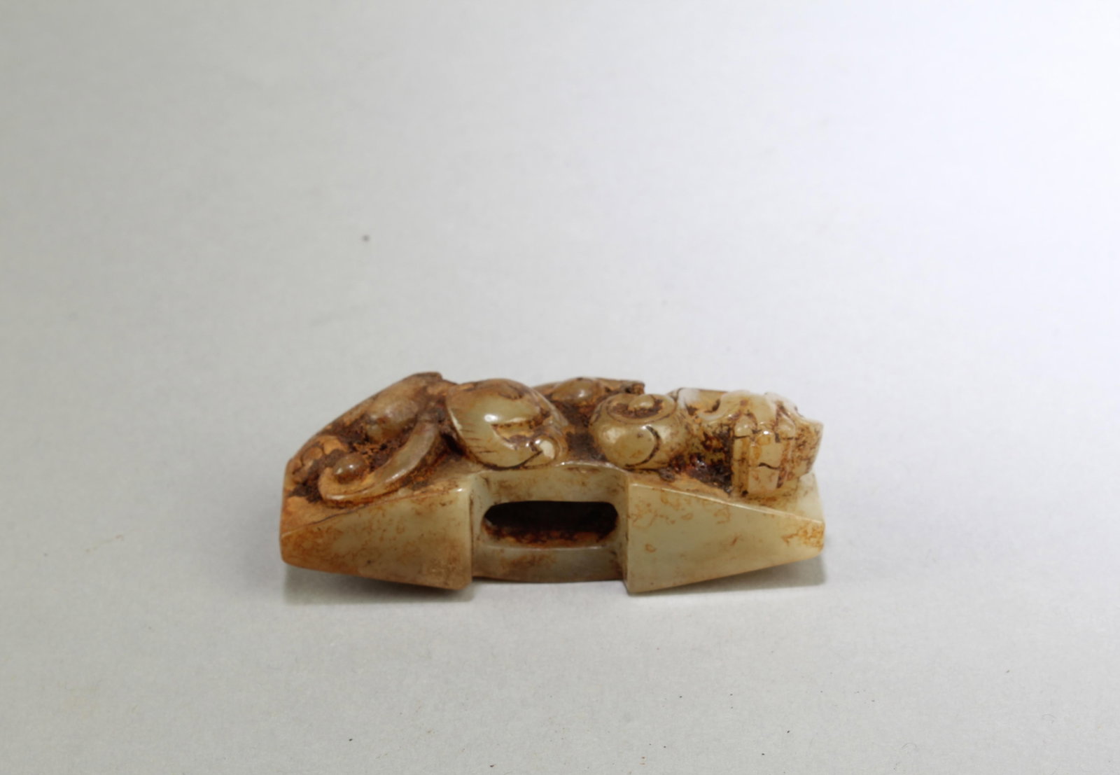 A Carved Jadestone Sword Guard: A Carved Jadestone Sword Guard. Length: 2.75"