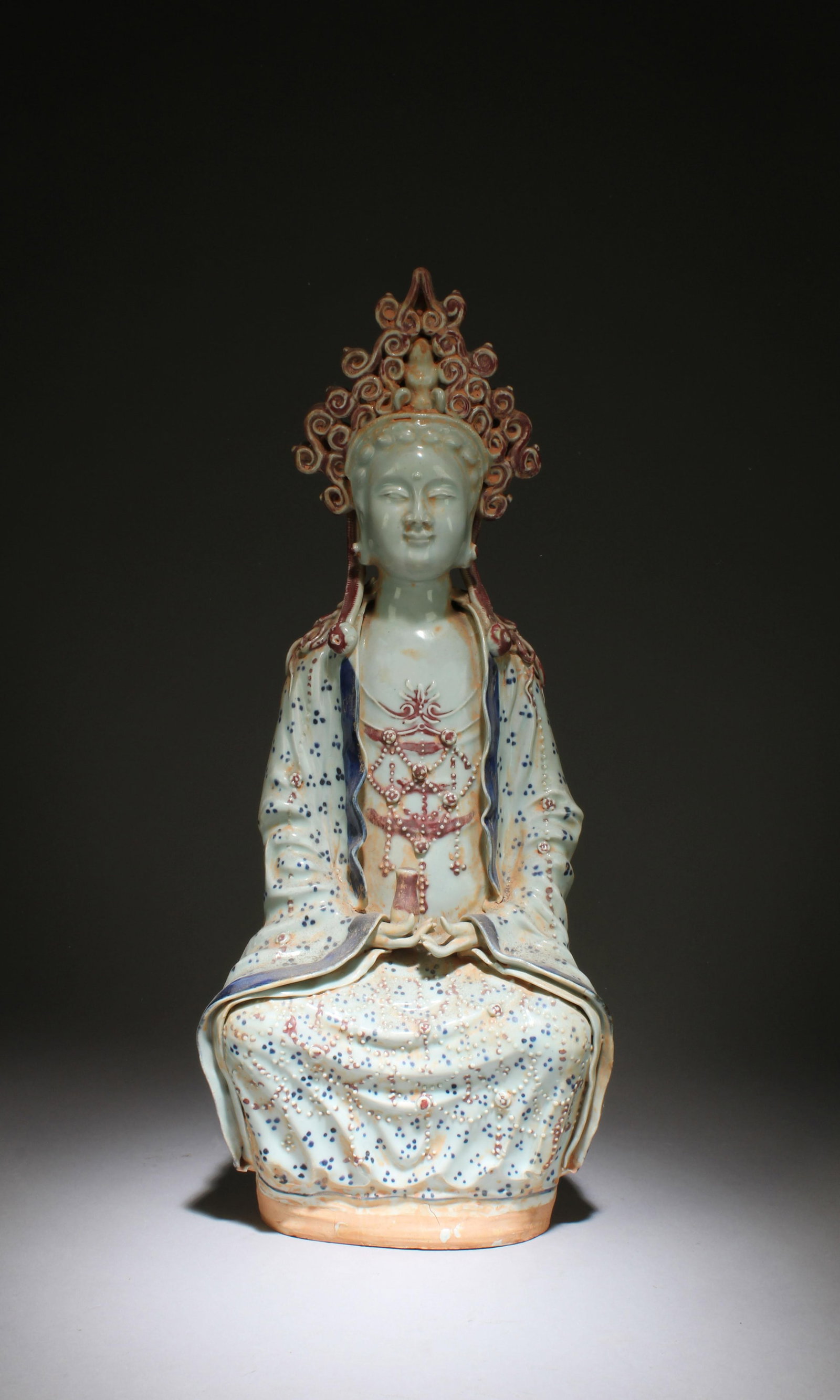 A Porcelain Seated Guanyin: A Porcelain Seated Guanyin. Dimension: 19''x8.1''