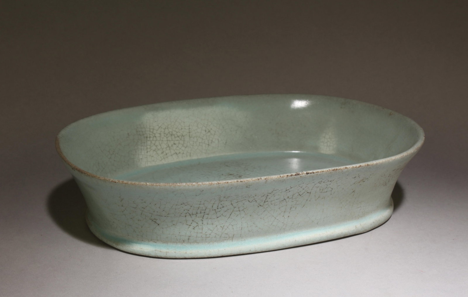 A Chinese Ruyao Brush Washer: A Chinese Ruyao Brush Washer. Dimensions: 2.1" x 9.5" x 6.4".