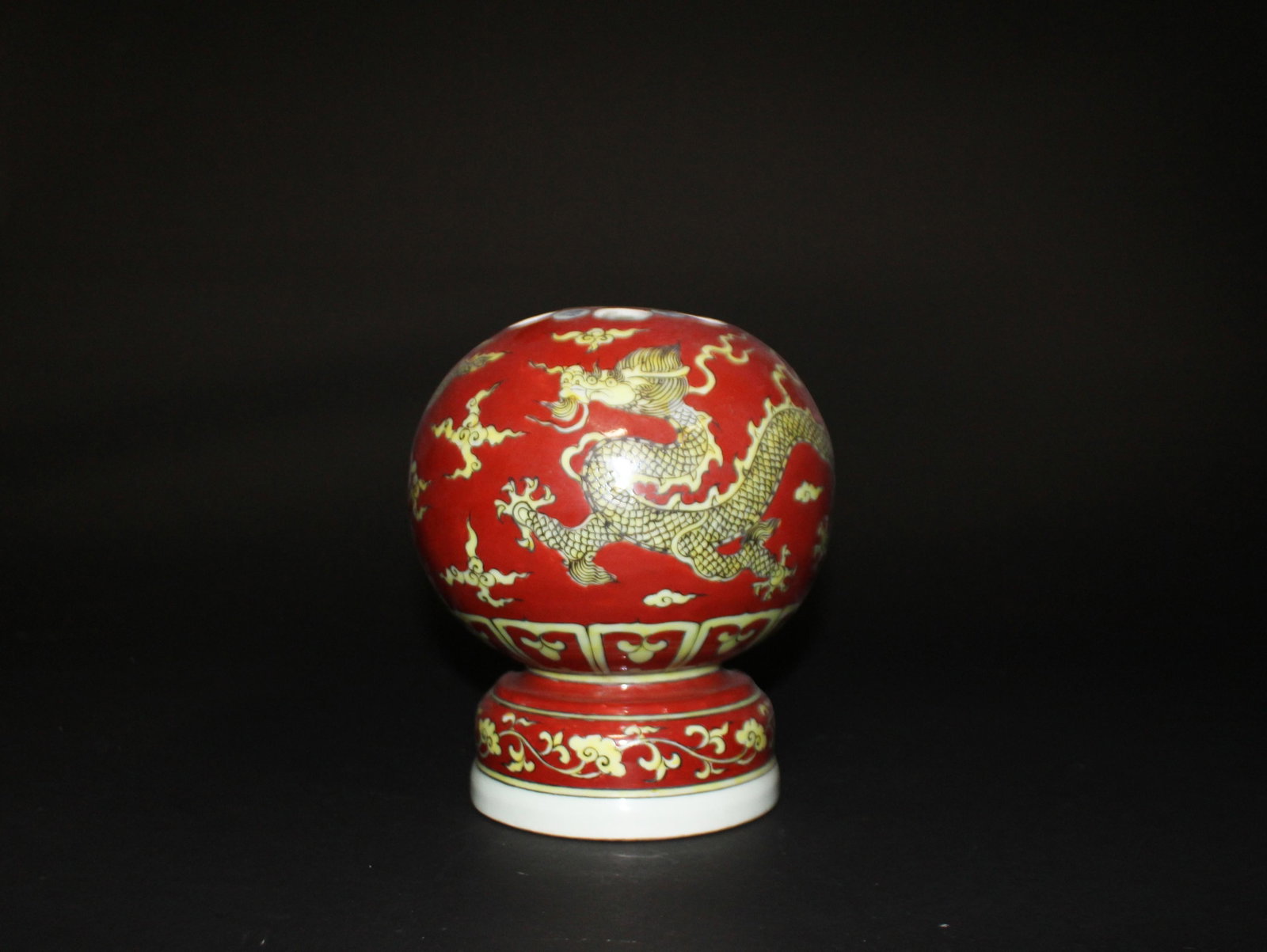 A Red and Yellow Bursh Holder: A Red and Yellow Bursh Holder. Dimensions: 8.5" x 7.2".