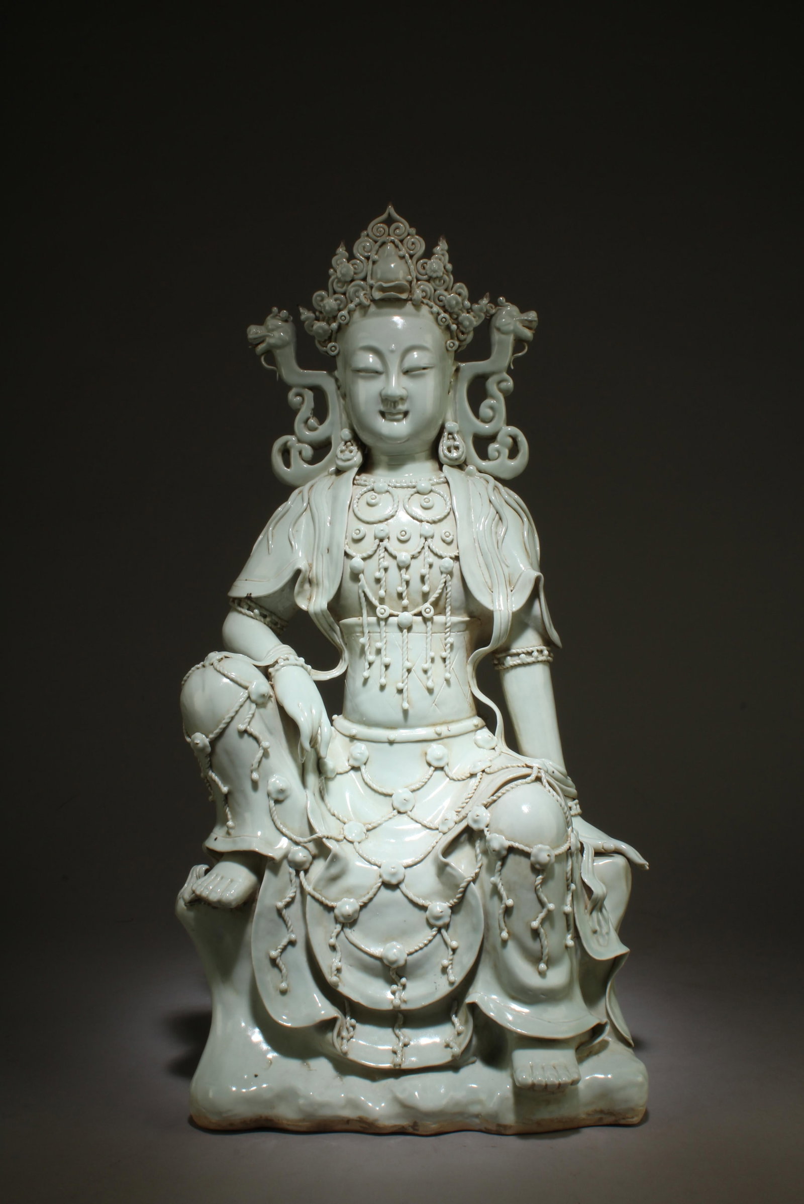 A Yin Qin Glazed Guanyin Seated Statue: A Yin Qin Glazed Guanyin Seated Statue. Dimensions: 21.5" x 11.5".