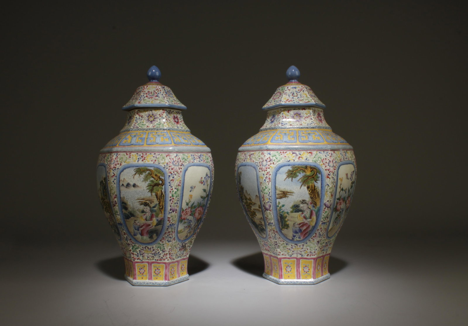 A Pair of Chinese Porcelain Vases with Lid: A Pair of Chinese Porcelain Vases with Lid. 'QianLong' mark at base. Length: 6" Height: 11"