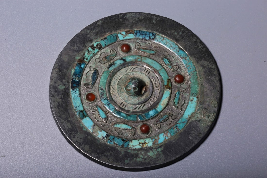 A Bronze Inlaid Mirror: A Bronze Inlaid Mirror. Diameter: 3.54in; Thickness: 0.12in; Weight: 4.09oz.