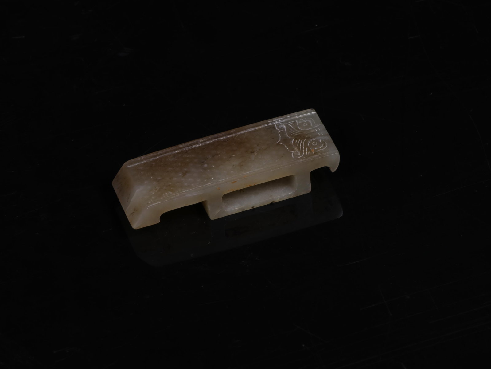 A Bronze Sword Fitting: A Bronze Sword Fitting. Length: 2.52in; Width: 0.87in; Thickness: 0.51in.