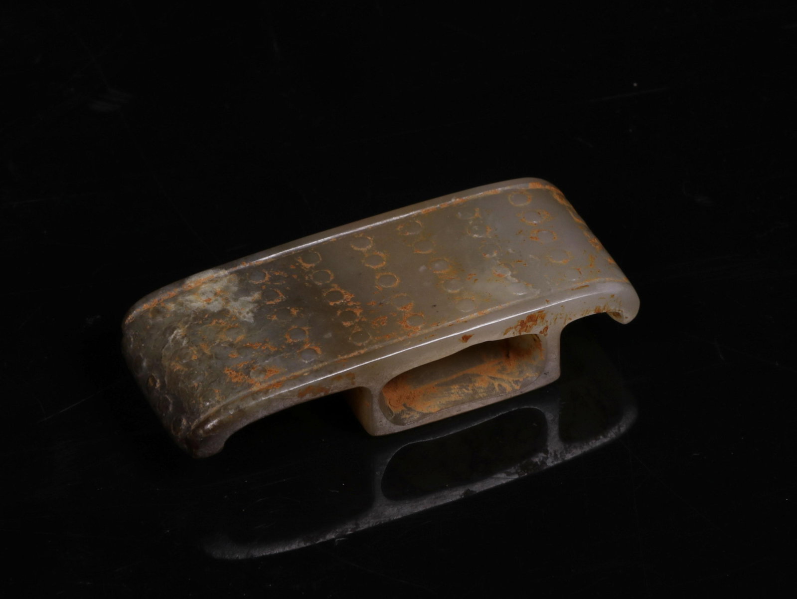 A Bronze Sword Fitting: A Bronze Sword Fitting. Length: 2.13in; Width: 0.83in; Height: 0.00in; Thickness: 0.47in.