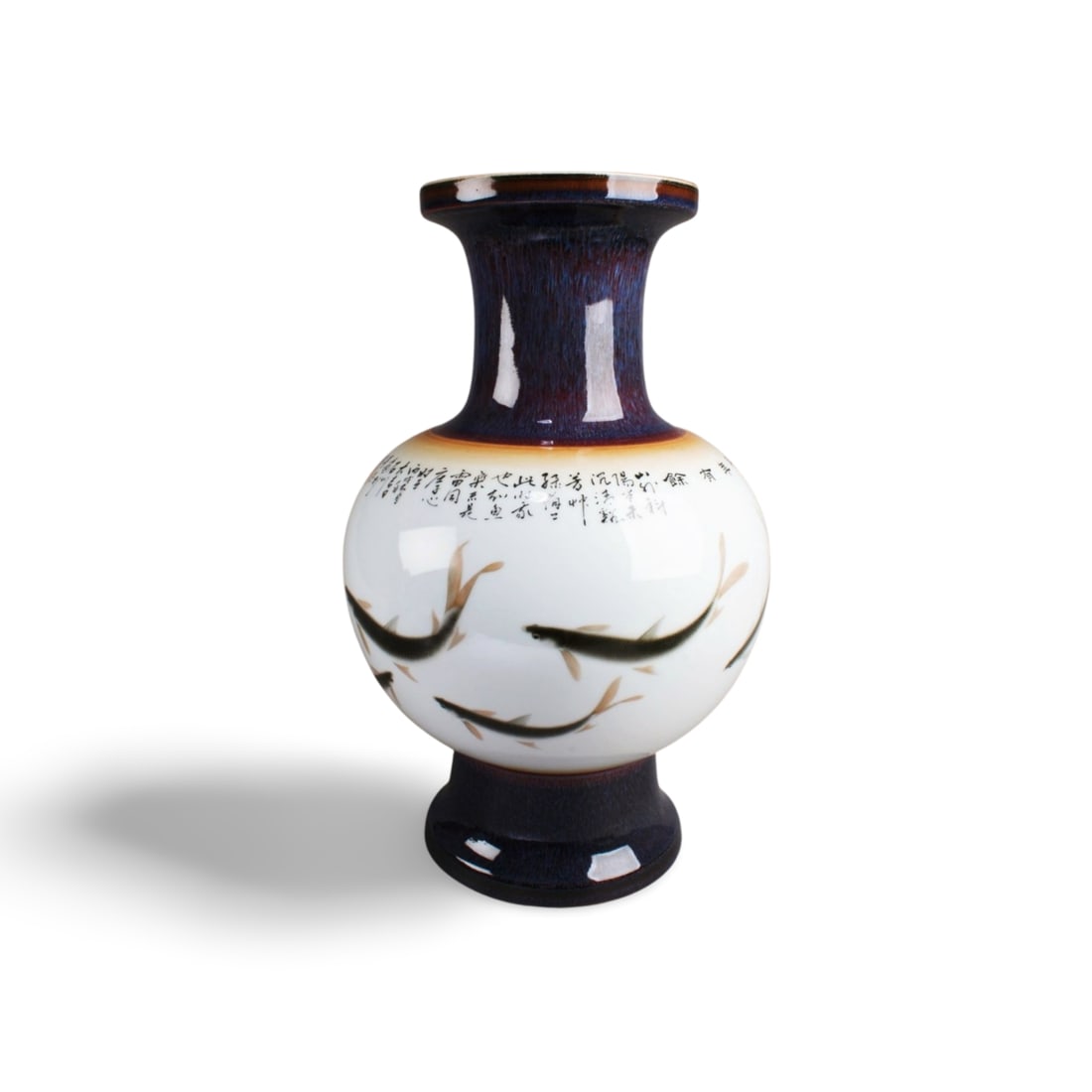 A Chinese Porcelain Vase: Supported by a tall circular foot ring, and rising to a flared rim, the bulbous body is painted with fishes and Chinese calligraphy. Diameter: 9.5 " Height: 15.75 "
