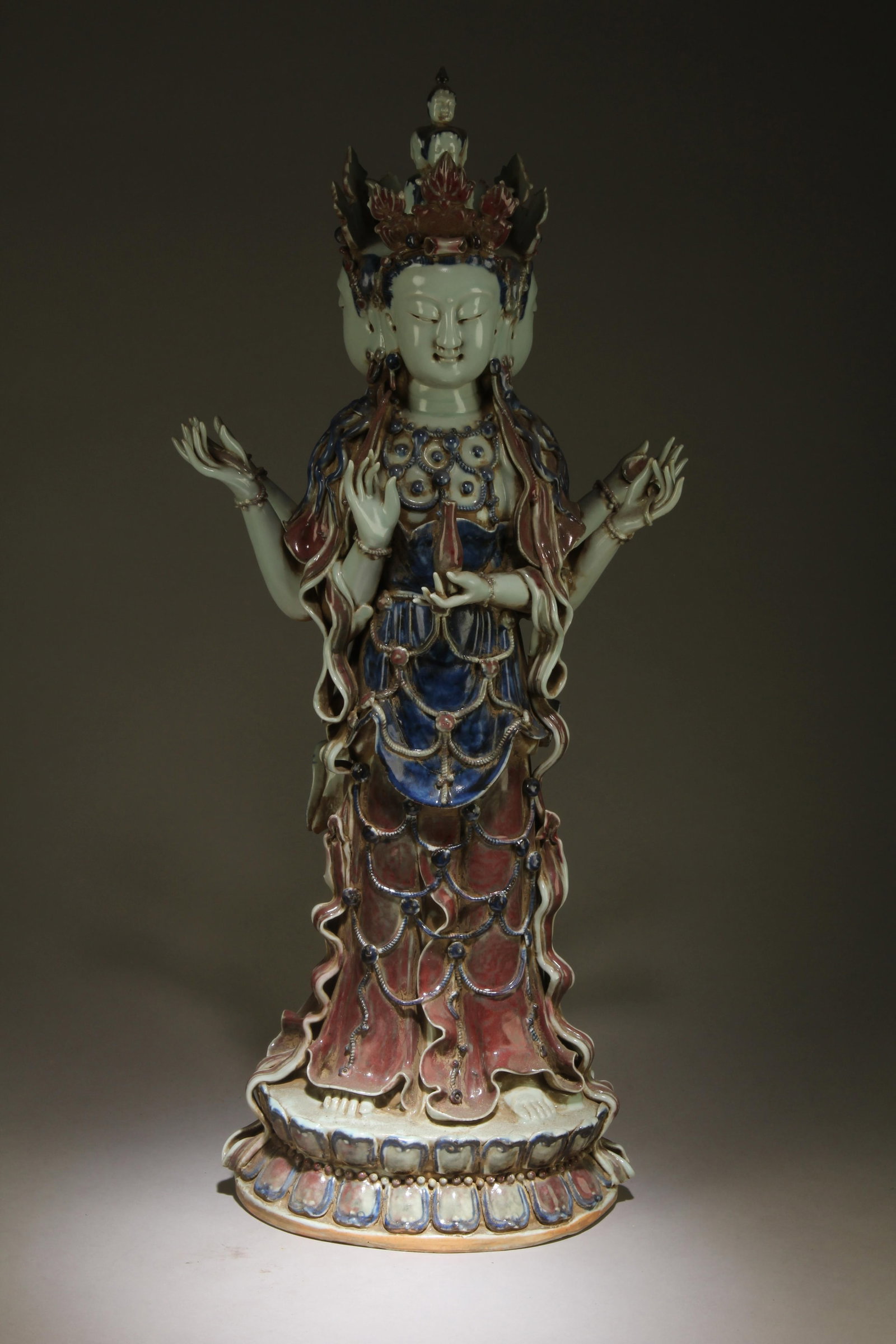 A Tibetan Tara Bodhisattva Statue: A Tibetan Three Face Six Arm Tara Bodhisattva Statue. Dimensions: 26.25" x 12" x 7.25".