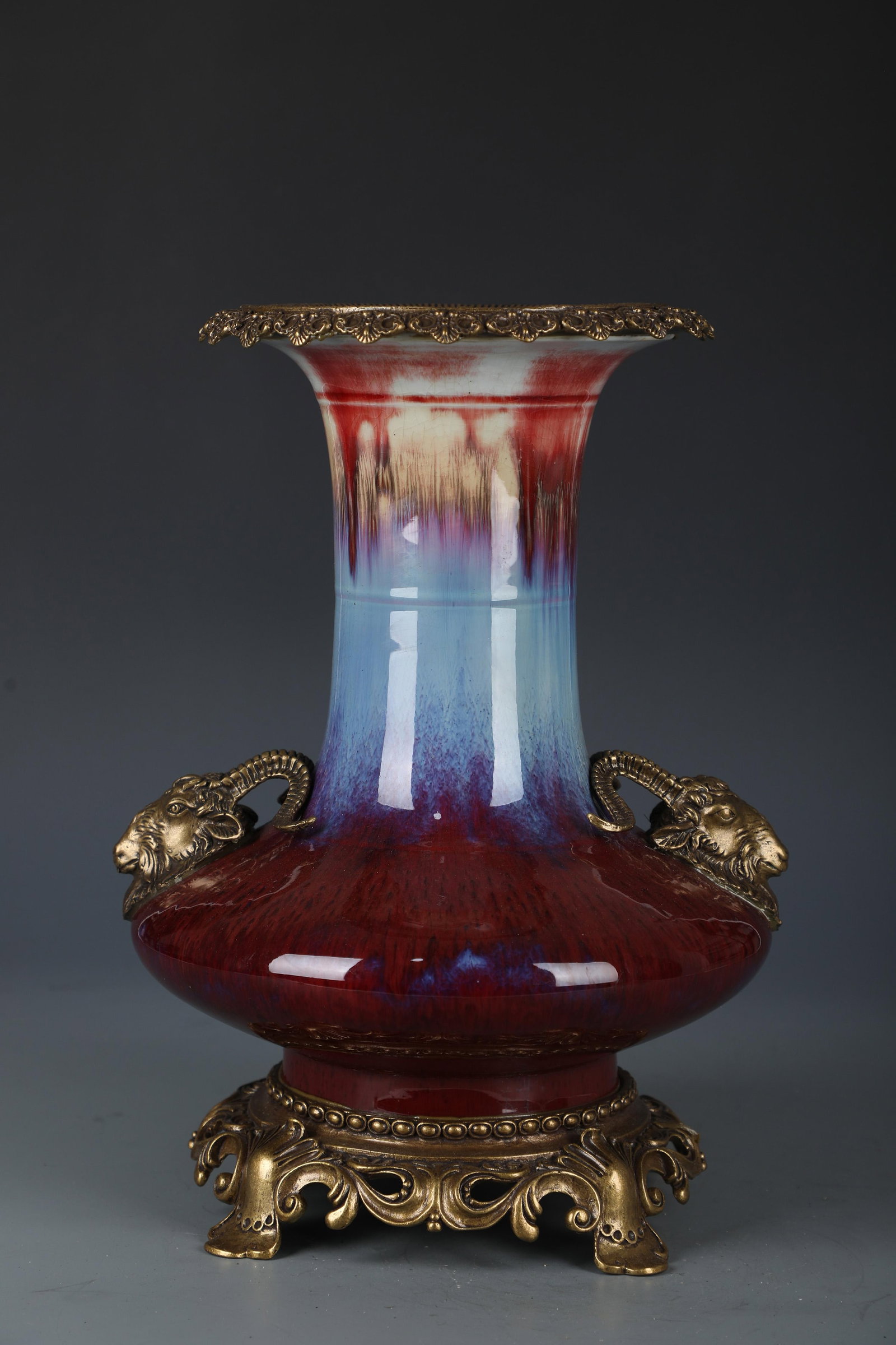 Chinese Porcelain Vase: hinese Porcelain Vase, the base and rim encased with bronze. 'QianLong' mark at base. Height: 13.97" Diameter: 9.84"