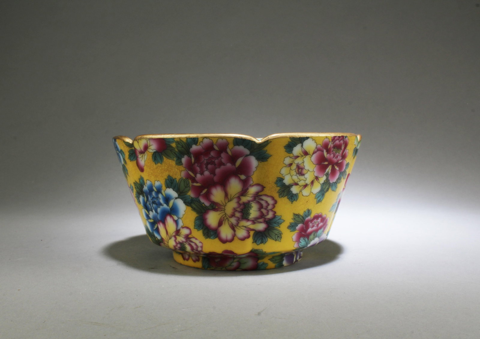 A Famille Jaune Porcelain Bowl: A Famille Jaune Porcelain Bowl. 'QianLong' mark. Height: 3" Diameter: 5.75"