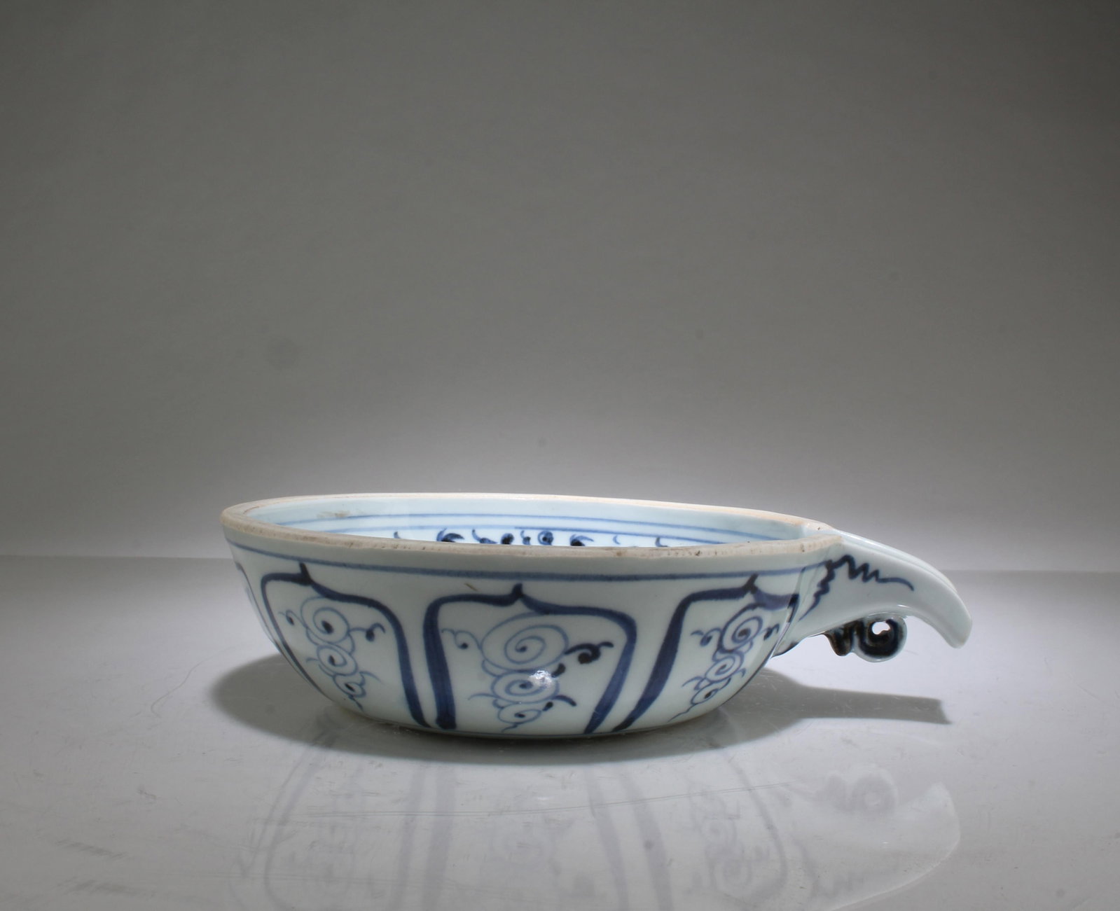 A Blue & White Ink Washer: A Blue & White Ink Washer. Length: 7" Height: 1.75"