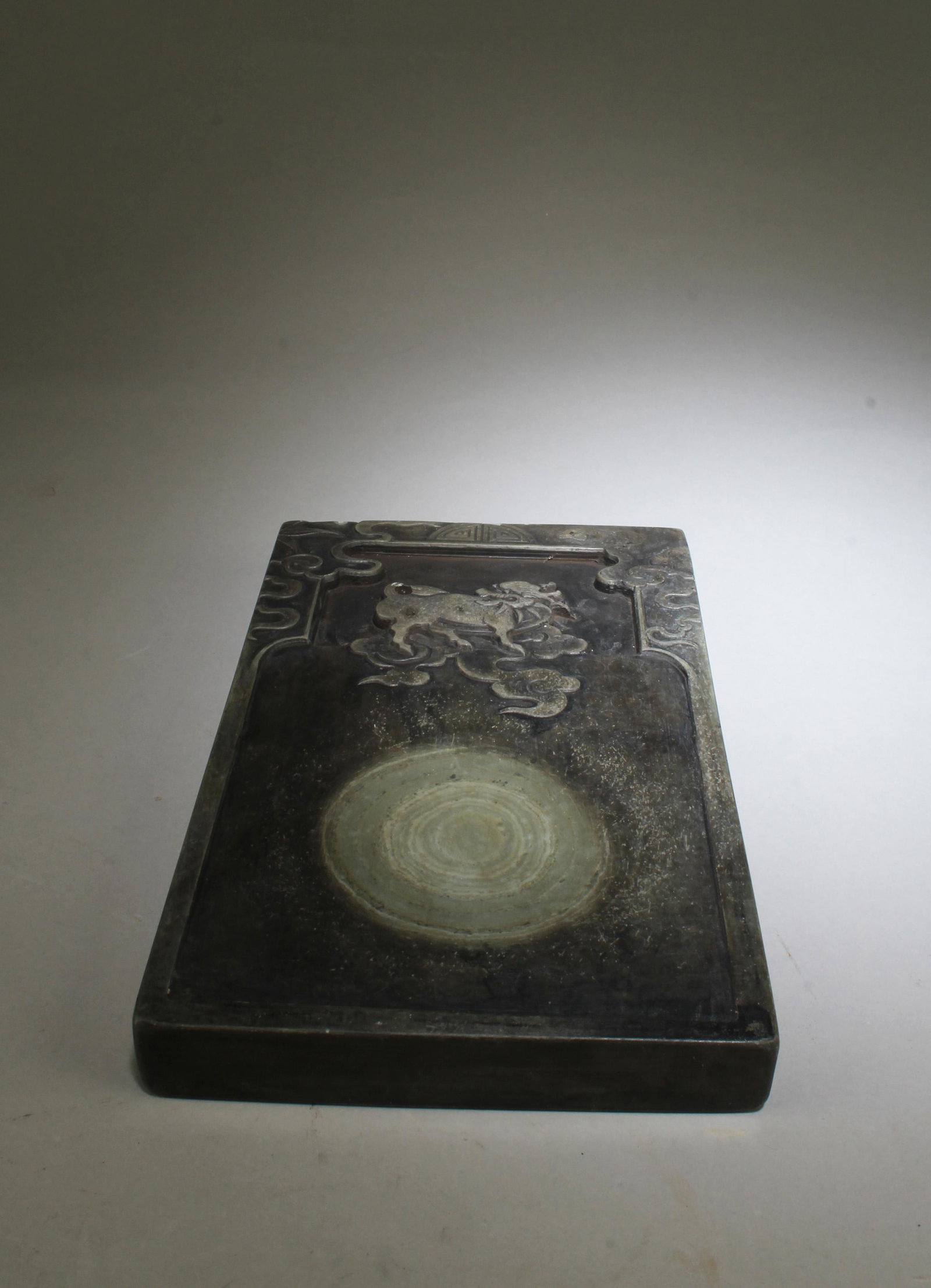 An Inkstone: An Inkstone. 'QianLong' mark at base. Length: 9" Width: 5.7" Thickness: 1"