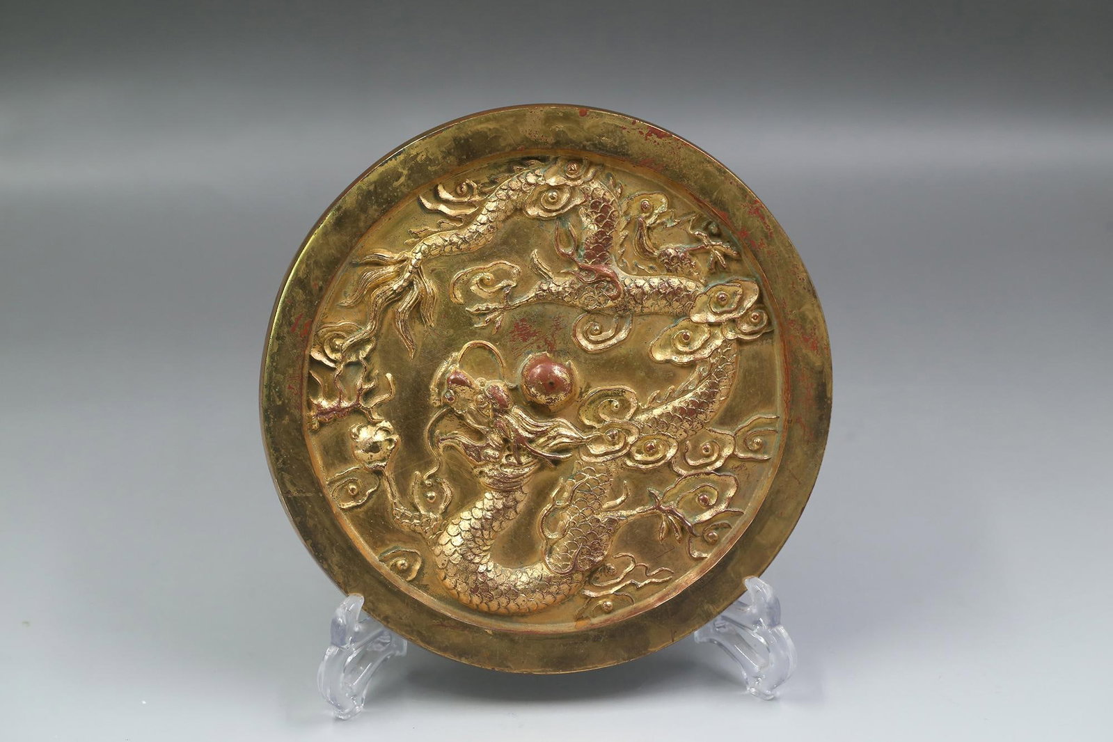 A Gilt Bronze Round Mirror: A Gilt Bronze Round Mirror. Diameter: 8.35"