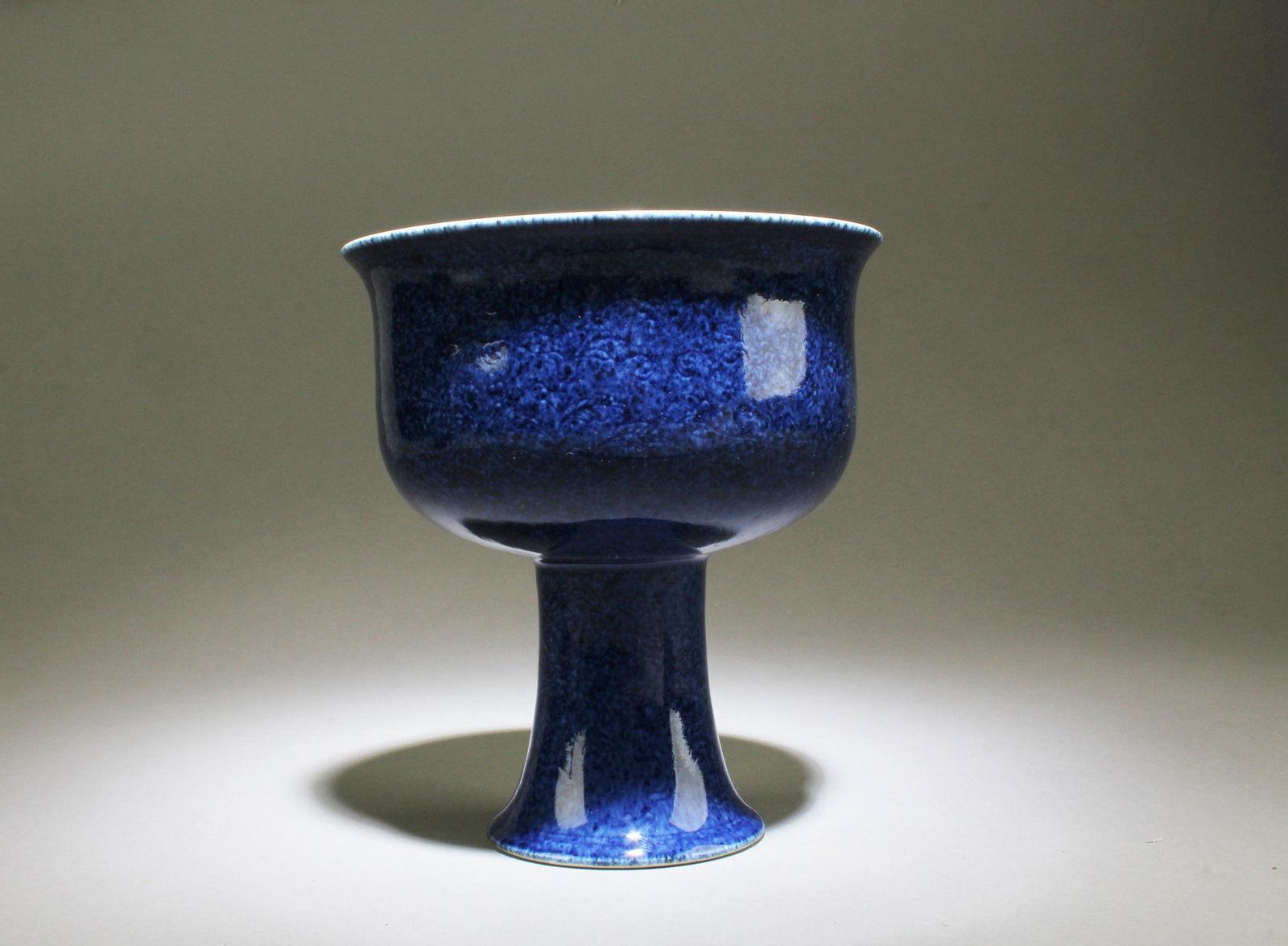 A Blue Color Porcelain Stem Cup: A Blue Color Porcelain Stem Cup. 'XuanDe' mark. Diameter: 6.6" Height: 3"