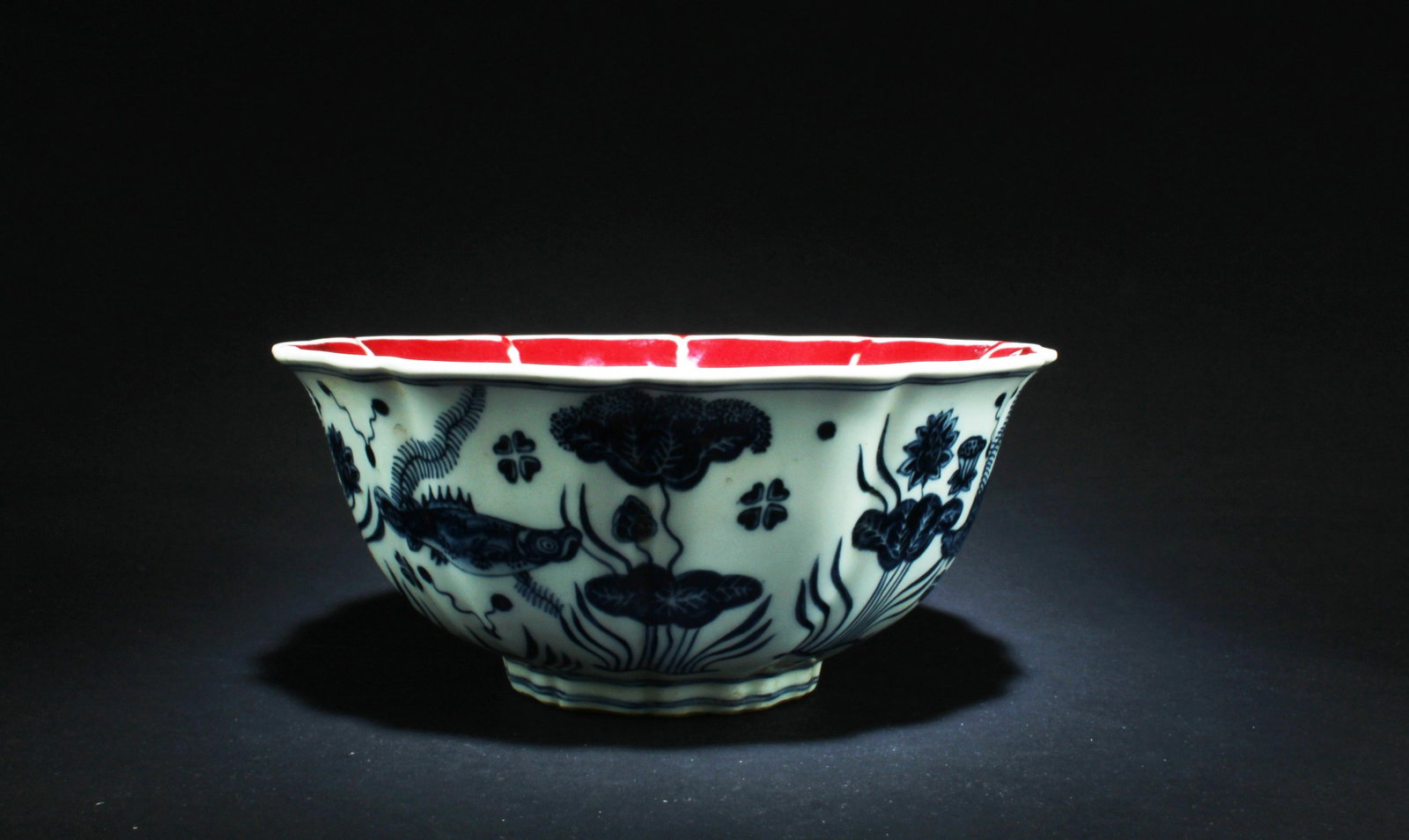 A Porcelain Bowl: A Porcelain Bowl, interior red color. 'XuanDe' mark. Diameter: 9" Height: 4"