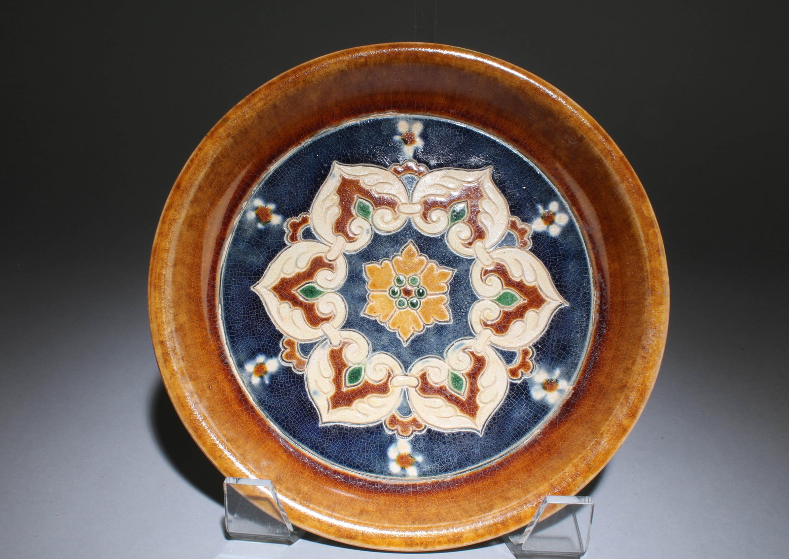 A Sancai Plate: A Sancai Plate. Dimensions: 8.6" x 1.25".