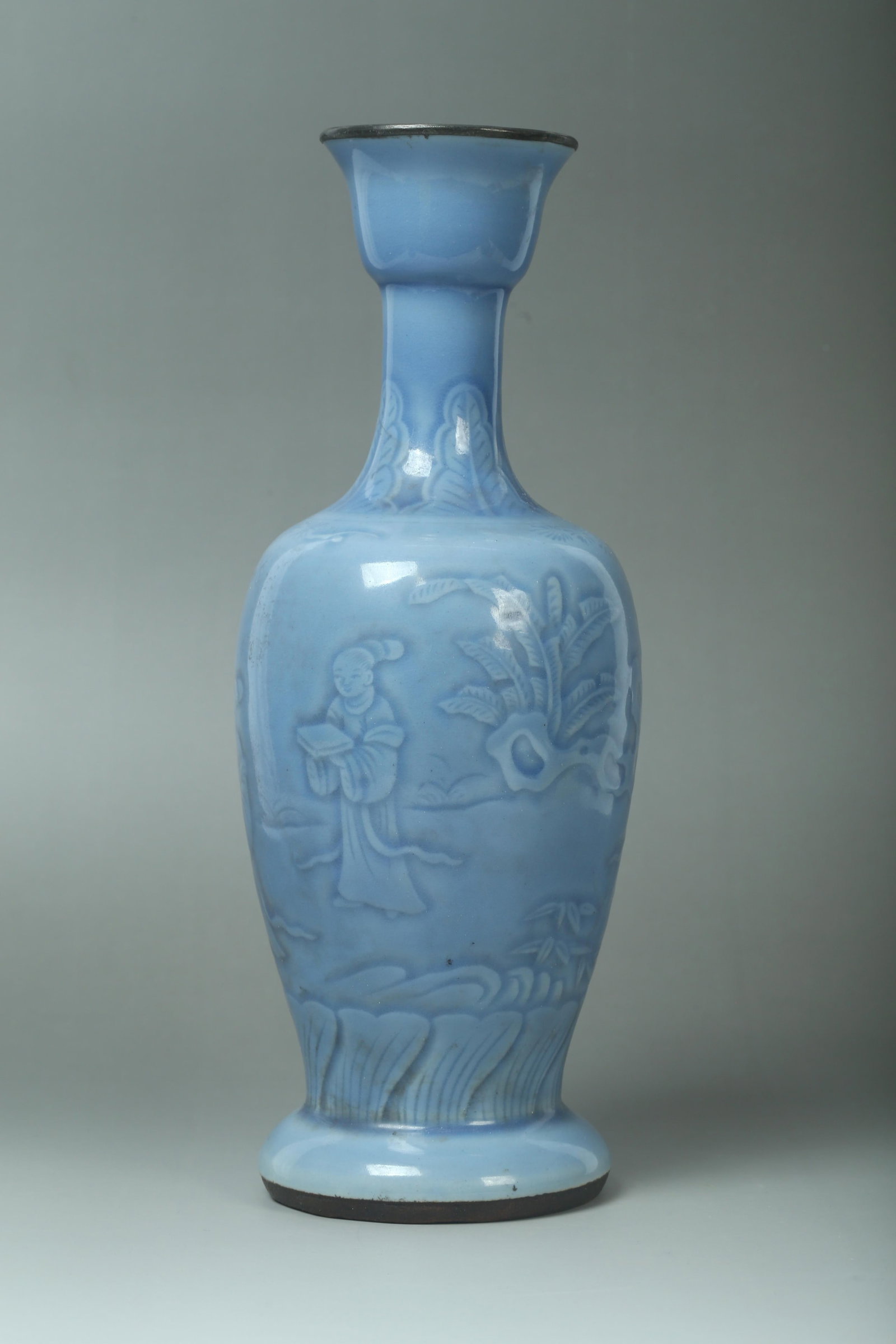 A Porcelain Vase: A Porcelain Vase, mouth rim and base with bronze lining. Height: 13" Diameter: 5"