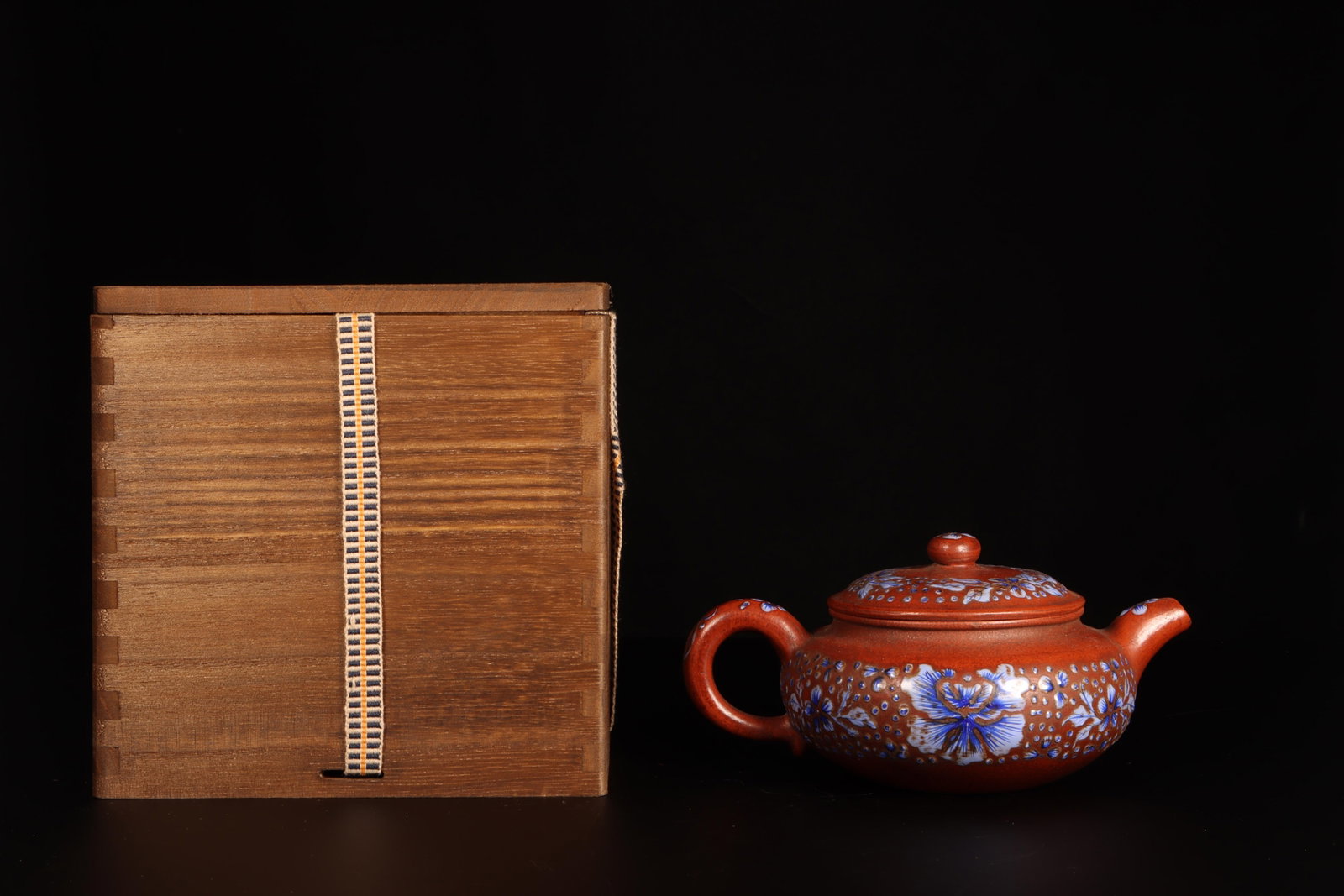 A Zisha Teapot: A Zisha Teapot. Comes with box. Height: 3.1in Diameter: 6.5in.