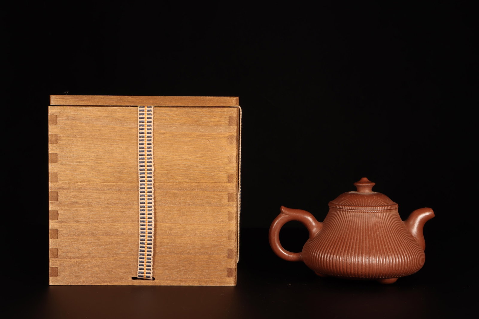 A Zisha Teapot: A Zisha Teapot. Comes with box. Height: 3.5in Diameter: 5.7in.