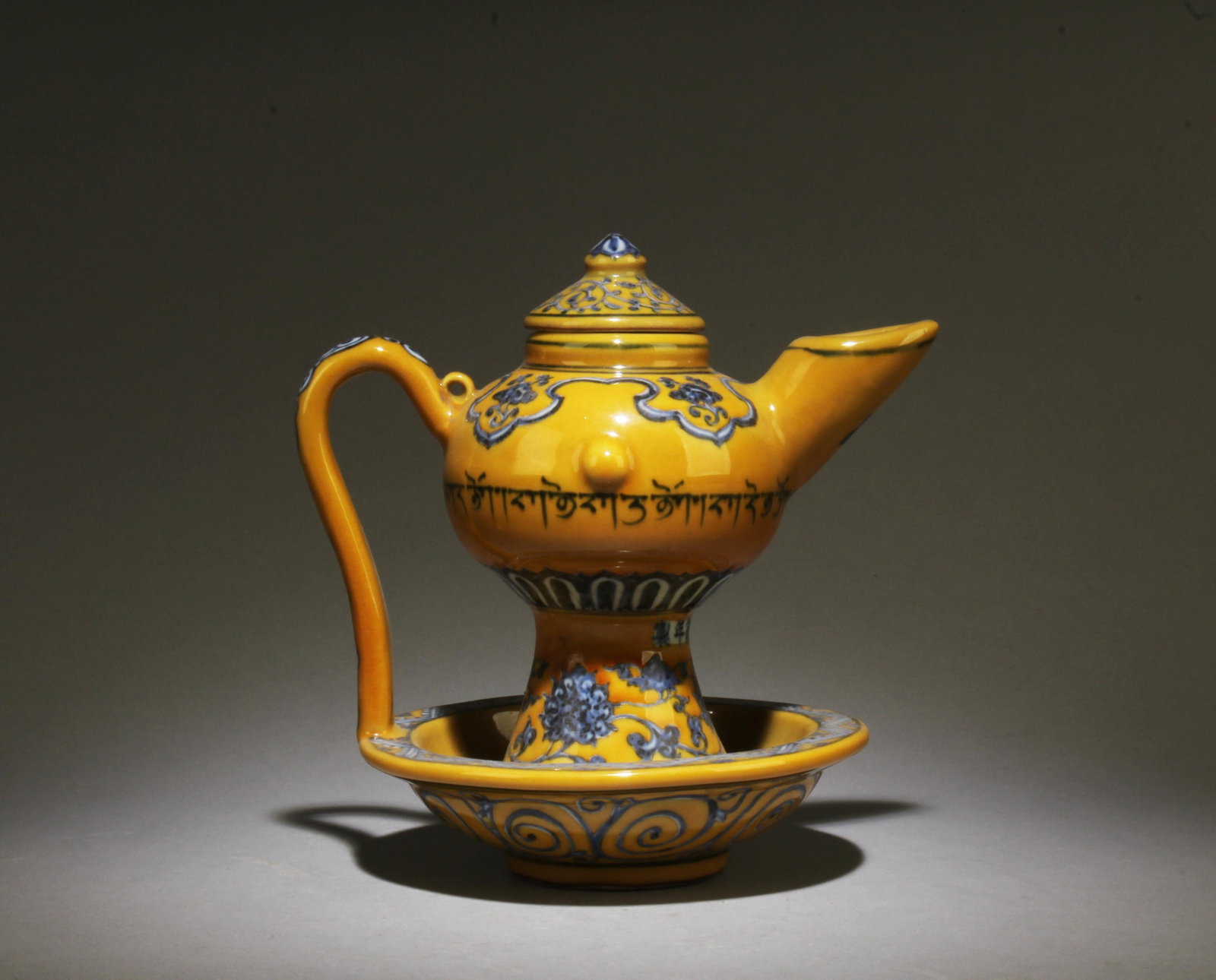 A Blue and Yellow Teapot: A Blue and Yellow Teapot. Dimensions: 7.5" x 7.25".