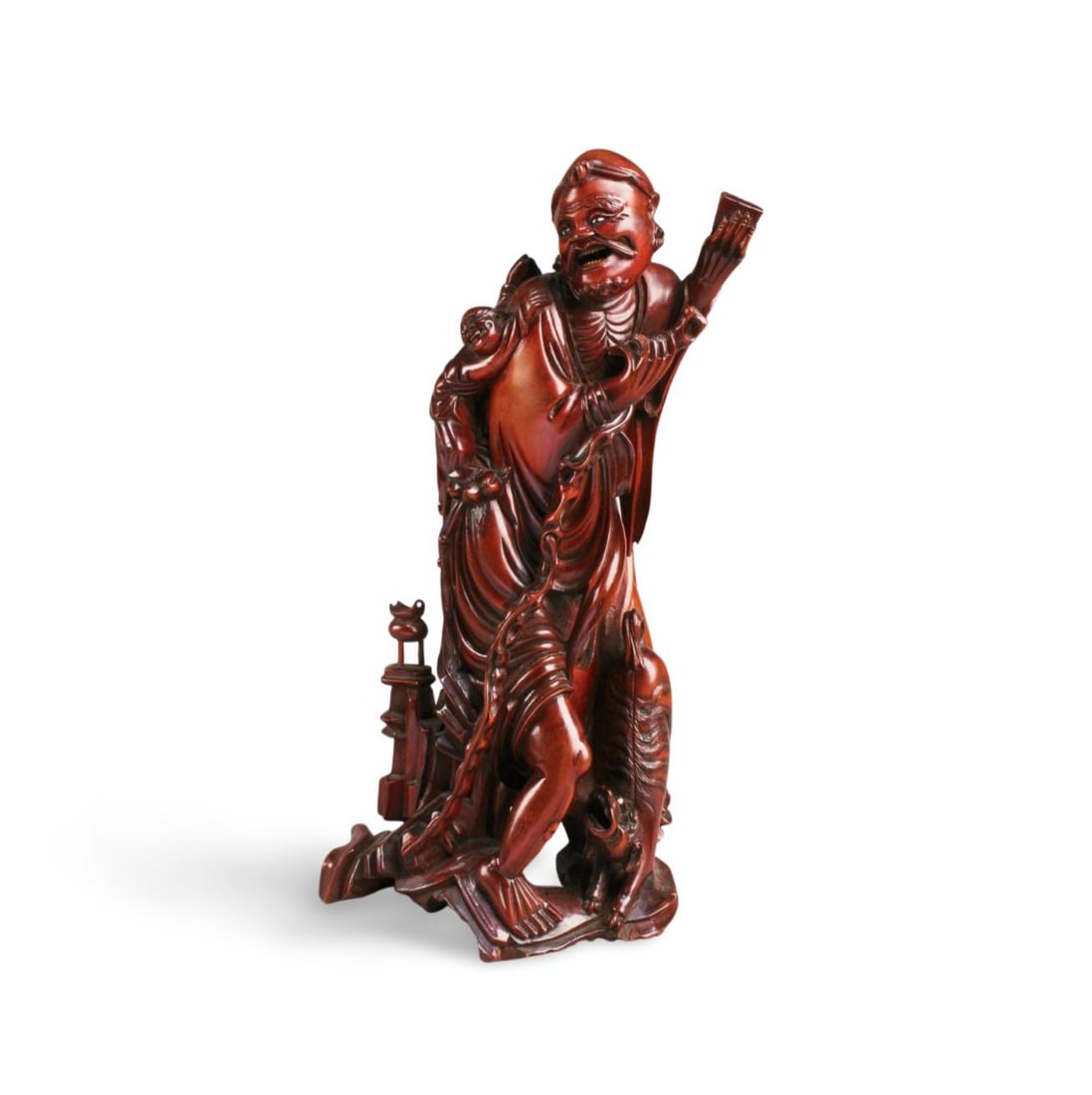 A Carved Wooden Figurine: A Carved Wooden Figurine. Height: 10.75"