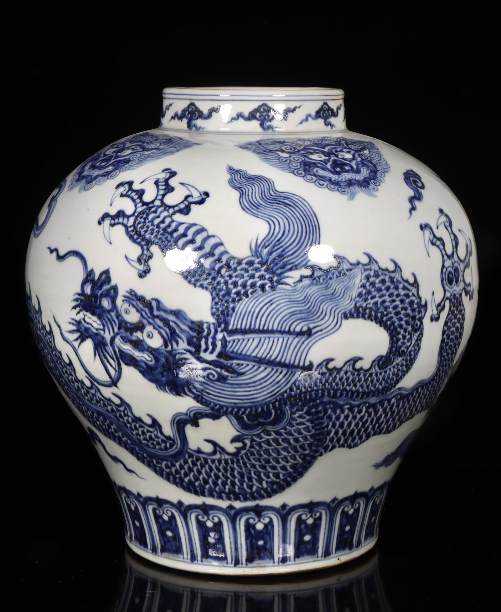 A Blue and White Dragon Jar: A Blue and White Dragon Jar. Dimension: 12" x 13.5".