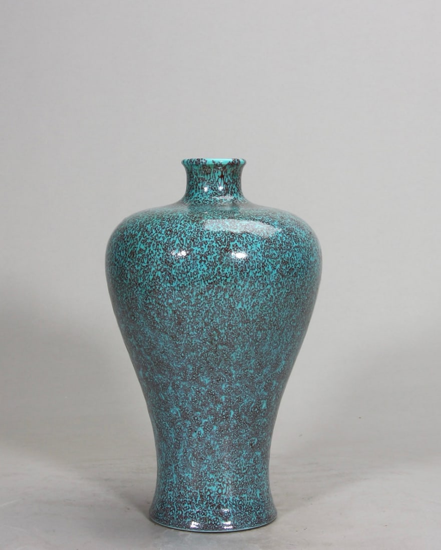 A ROBIN'S EGG-GLAZED PRUNUS VASE, YONGZHENG PERIOD, QING DYNASTY: H 20.5cm (8.07 in)A Yongzheng period robin's egg-glazed prunus vase. Elegantly shaped with smooth glaze, showing natural blue-purple kiln changes. Well-preserved, it is a rare treasure of monochrome g