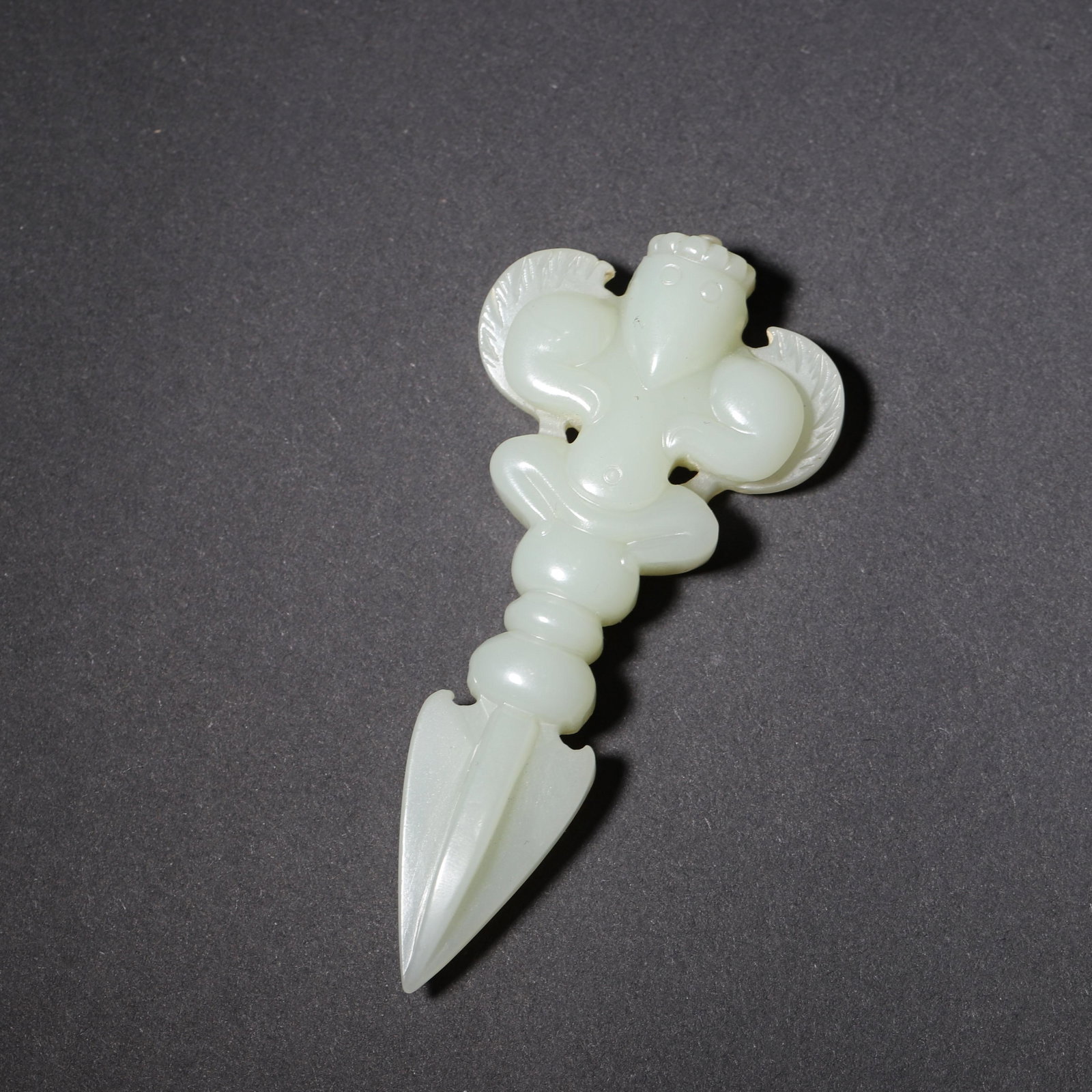 A HETIAN JADE GARUDA VAJRA PESTLE, QING DYNASTY (1 of 7)