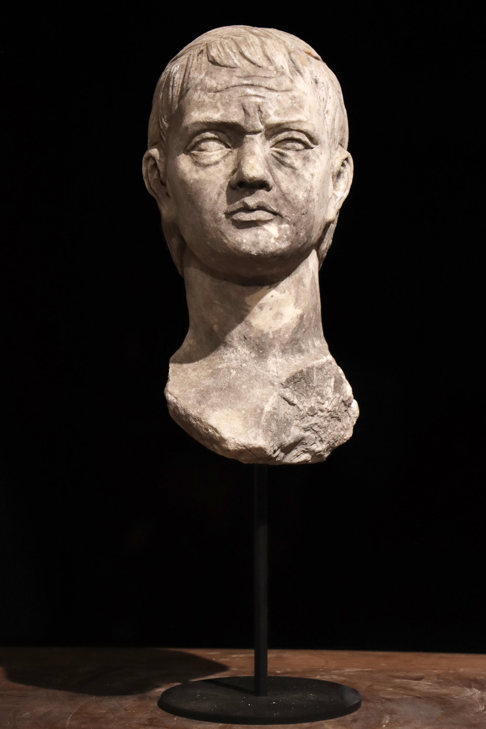 A 3TH-CENTURY ANCIENT GREEK STONE-CARVED HEAD: Total height: 40cm (15.75in) Net height: 25cm (9.84in)