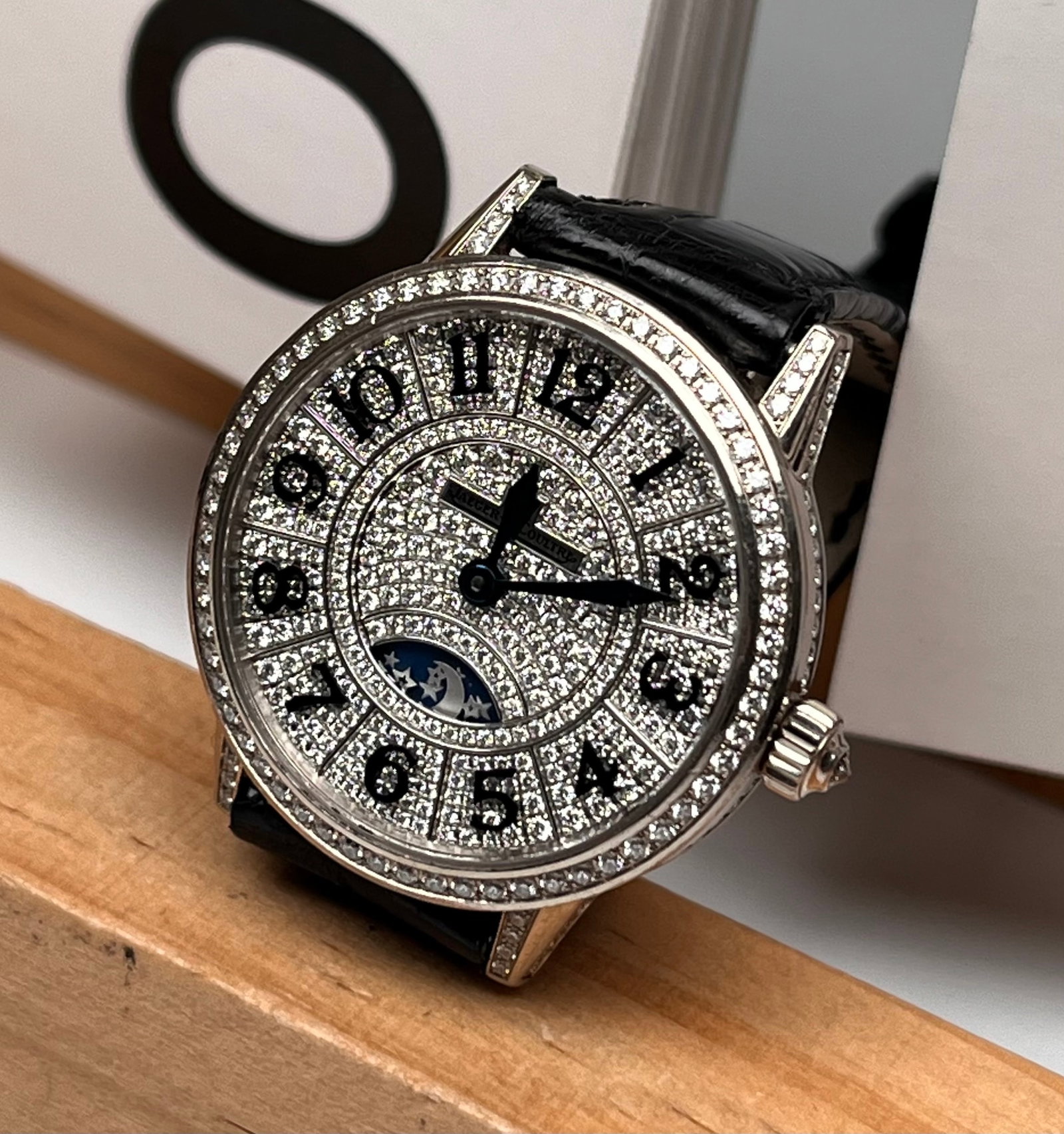 JAEGER-LECOULTRE 18K WHITE GOLD CASE DIAMOND-SET LADIES' WATCH: 29mm 18K white gold case set with 168 diamonds totaling approximately 1.8 carats, white diamond-set dial, day-night indicator at 6 o'clock position, 28 gemstones