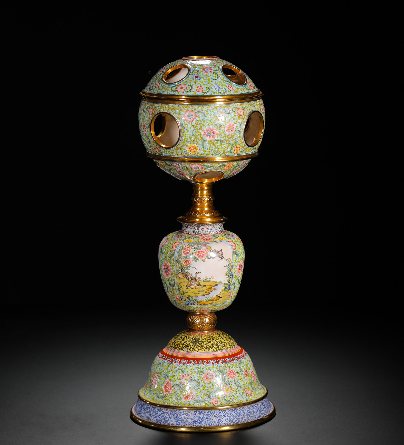 QING DYNASTY COPPER-PAINTED ENAMEL FLOWER-AND-BIRD PATTERN ROTATING HEART CROWN STAND: H:33cm(12.99in)D:11cm(4.33in)Weight:1390g(3.06lb)These objects were used in the Qing court to display official hats. The flower and bird motifs symbolized prosperity, reflecting the cultural exchange 